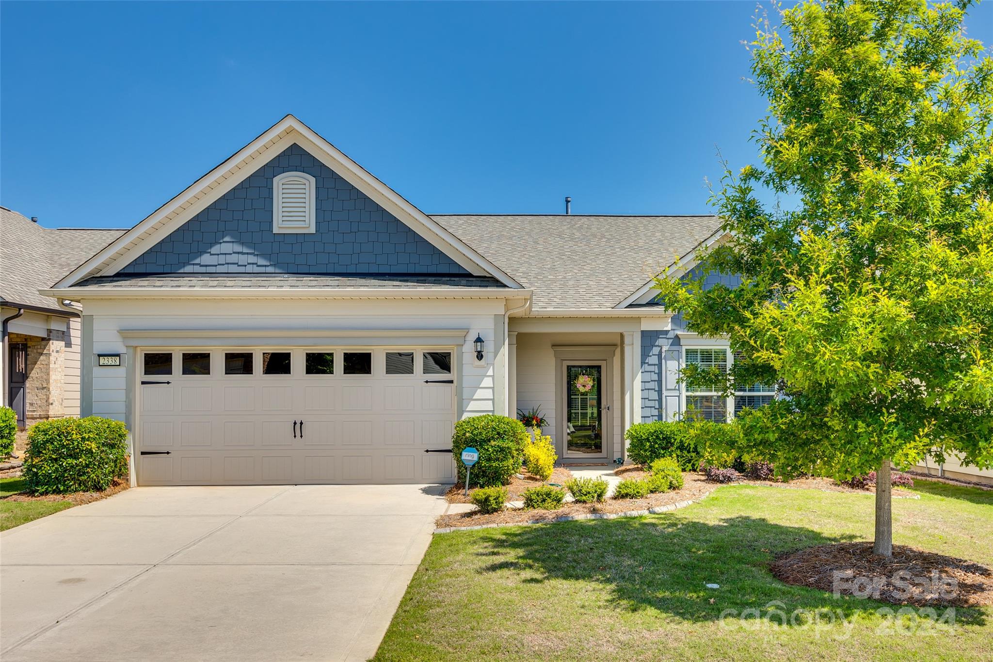 Welcome to this meticulously maintained home..Martin Ray plan that sits on a lot backing to a privacy berm. You will be immediately impressed with the bright open floor plan. Features include a white kitchen with Quartz counters, stainless appliances, and an oversized island. The layout boasts a sunroom, large patio, office, 3 bedrooms and 2 baths. The primary suite has a walk-in shower with double shower heads,  quartz dual sink vanity. Over $50k of updates completed in the last year. Community amenities include a fitness center, pools, and pickleball courts, conveniently close to grocery store, restaurants, interstate and more!