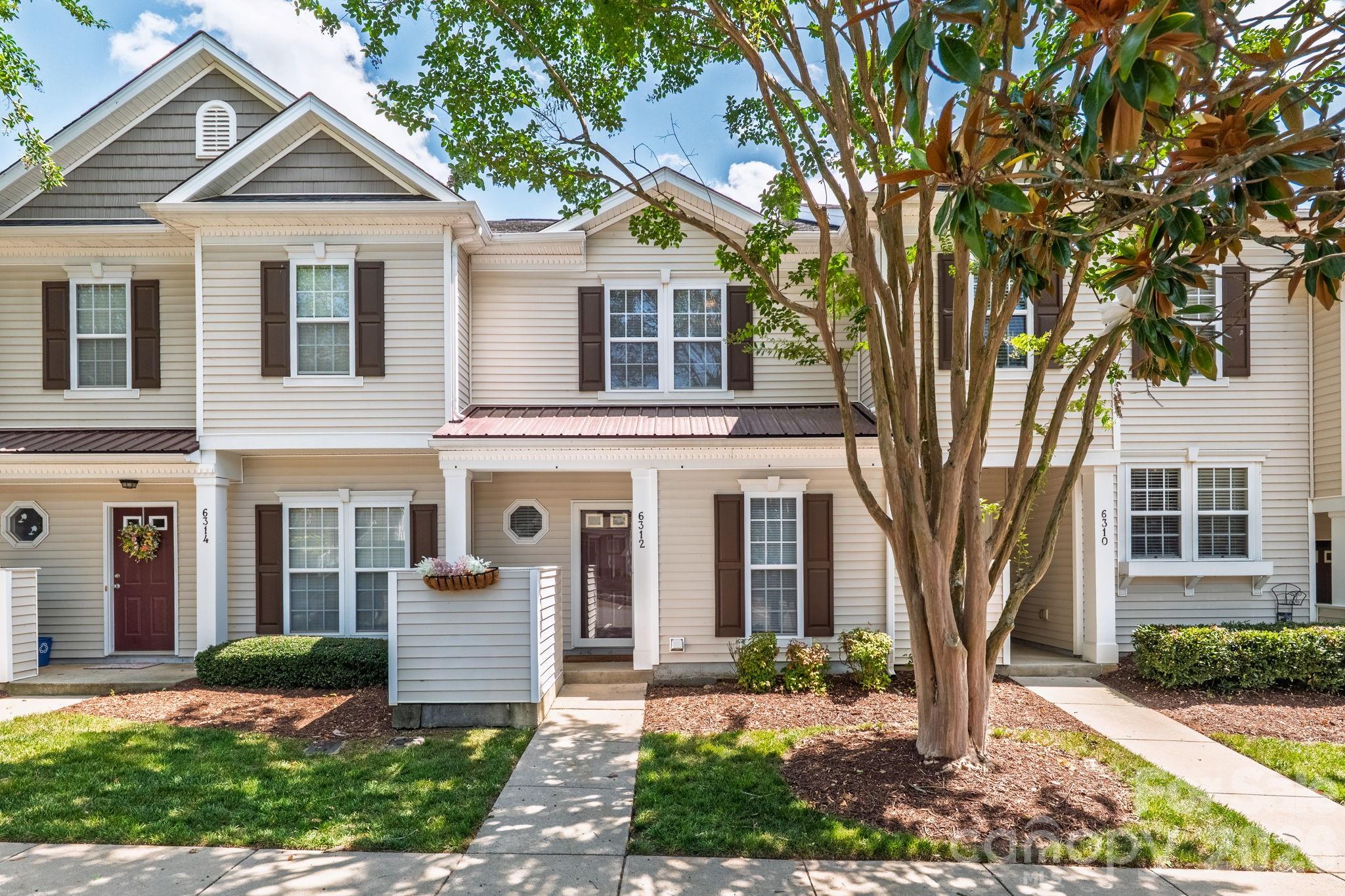 A rare find for the neighborhood! Unlike other townhomes in Arlington that feature a wall obstructing the view from the entry to the kitchen, this home boasts a completely unique, wide-open layout. The seamless flow from the kitchen to the family room ensures anyone preparing meals stays fully connected with guests and family. The kitchen features solid-surface countertops, stainless steel appliances, refrigerator replaced in 2021, and a convenient closet housing the stackable washer and dryer (both the fridge and washer/dryer stay!). The kitchen sink was relocated to the open bar overlooking the family room, impeccable design! The family room features a lovely fireplace with gas logs and French doors leading out to the semi-private back patio with a locking storage closet for all your outdoor furniture! Both bedrooms feature en-suite baths and generous walk-in closets, vaulted ceilings and ceiling fans! The primary bath has a completely renovated walk-in shower and the second bath has a deep soaking garden tub/shower combo! Located in a vibrant neighborhood with a pool, clubhouse and basketball court. Ballantyne is minutes away, commute to uptown Charlotte is 21 miles, Charlotte Douglas Airport is 22 miles, Lake Wylie Marina is only 16 miles. This home is truly unique, a rare find like this doesn't hit the market often. Schedule your tour today!