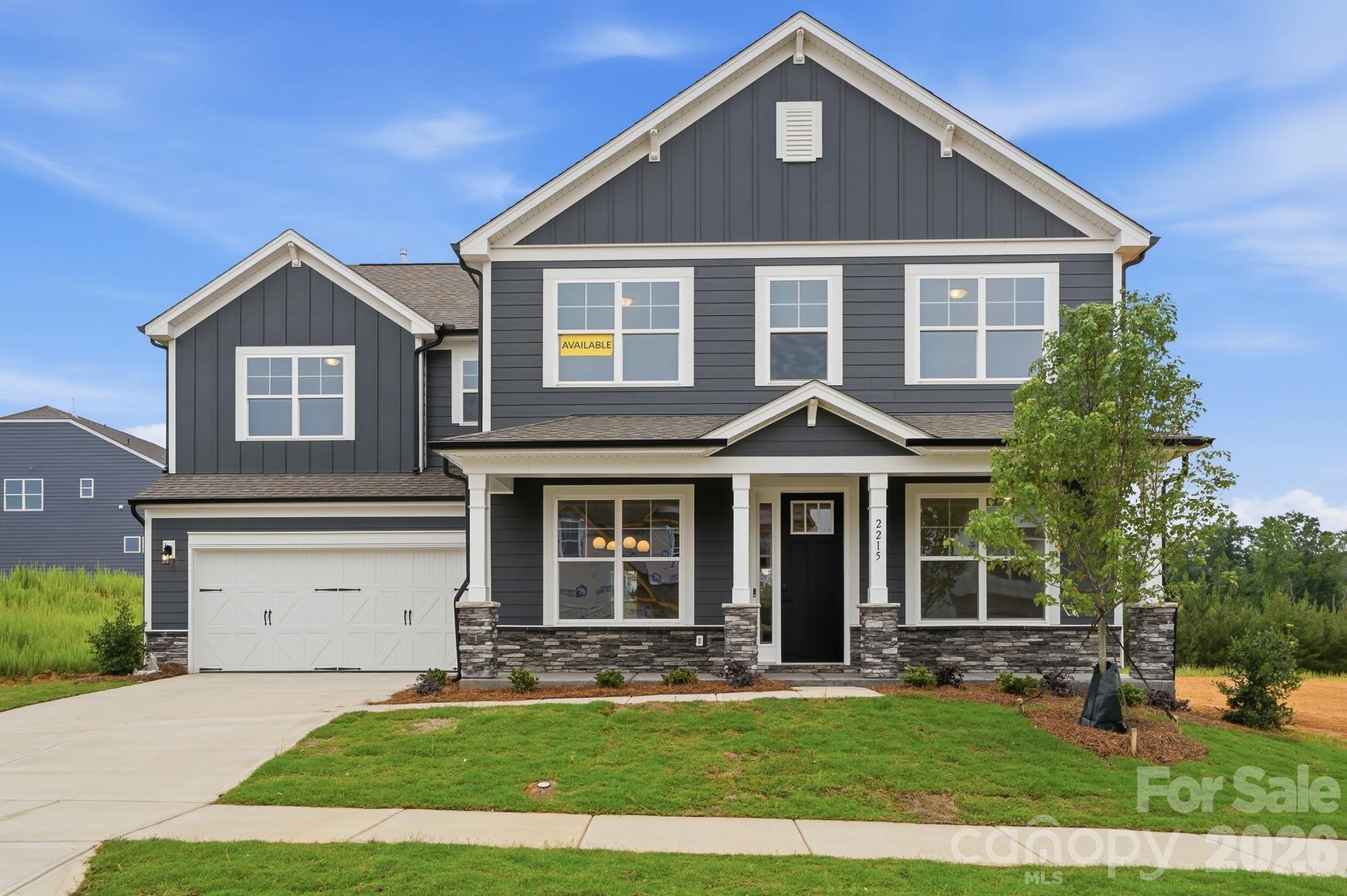 Brand new construction in an amenity-rich community less than two miles from Lake Norman. Live the "suite" life in this Colfax plan! The home offers ensuite bathrooms in the guest bedroom on the main, and the primary suite plus another secondary bedroom upstairs. Plenty of options for everyone with a total of 5 bedrooms, 4.5 baths, and more than 3,600 square feet of living space. The kitchen features a stainless range hood along with white cabinets, quartz counters, tile backsplash, gas cooktop and wall oven & microwave. The butler pantry also has upper and lower white cabinets and a tile backsplash. The main floor also includes a family room with gas fireplace, dining room with tray ceiling, and an office with French doors. The upper floor has 9-foot ceilings and has the primary suite with luxury bath, three secondary bedrooms (one with an ensuite bath), a loft, and laundry room. The rear of the home features a covered porch along with a paver patio, firepit & seating wall. Other wonderful extras include a foyer with tray ceiling, stairs with composite treads & metal balusters, and Craftsman-style wood trim. Community amenities include a pool, clubhouse, pickleball courts, and pocket parks!