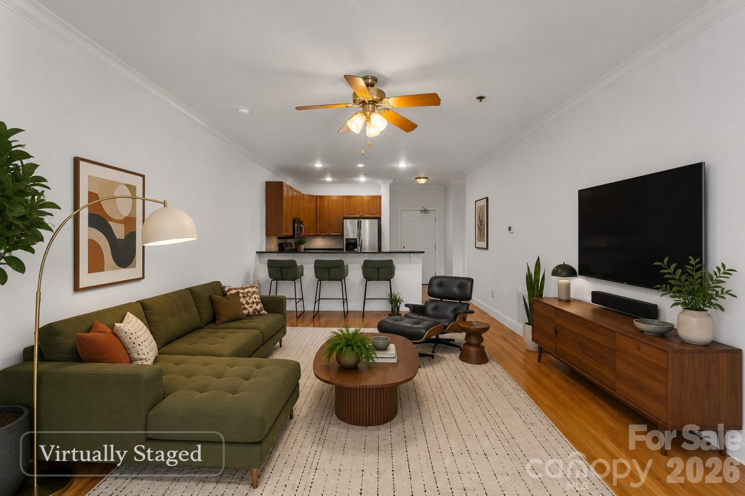 Live where Asheville comes alive! Wake up close to your favorite coffee shop, spend the afternoon browsing local boutiques, meet friends at nearby breweries, and enjoy live music just blocks from home. This 1BR/1BA downtown condo offers the convenience of secure building access, elevator service, gleaming hardwood floors, an open kitchen with breakfast bar, and a bright living space that extends to a private covered balcony. An assigned space in the secure parking garage makes coming home effortless, while HOA dues cover water, sewer, and trash. Whether you're seeking a city retreat, low-maintenance home, or investment property, this is your chance to own a piece of downtown Asheville.