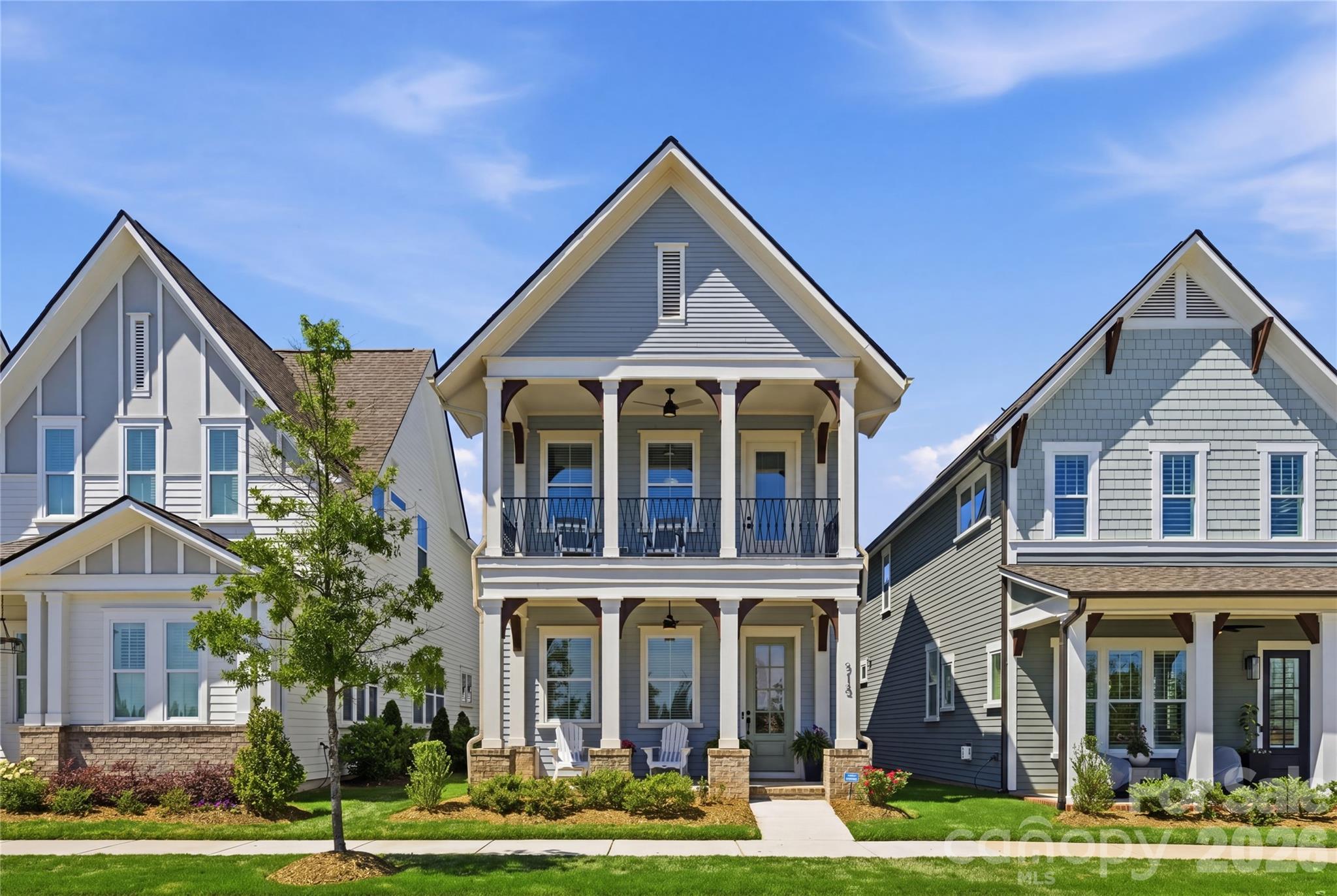 713 BARREL ALLEY presents an opportunity to own a newly constructed 2024 Saussy Burbank home in The Cottages at Springfield Town Center, one of Fort Mill’s most connected and architecturally distinctive communities. Designed with classic Southern architecture and Arts and Crafts influences, the residence is framed by double front porches, covered outdoor living spaces and thoughtfully curated interior finishes throughout. Inside, the open-concept layout blends functionality with elevated design. The main living area features luxury vinyl plank flooring, coffered ceilings, a gas fireplace and abundant natural light, creating comfortable everyday living and effortless entertaining. The kitchen is designed for both style and utility with quartz countertops, a farmhouse sink, gas cooktop and oven, extensive cabinetry and a walk-in pantry with custom shelving and dedicated coffee station. Upstairs, the primary suite offers direct access to a covered porch, creating a private outdoor retreat. The en-suite bath includes a zero entry shower, dual sink vanity and walk-in closet with custom organization. Two additional bedrooms provide flexibility for guests, office space or lifestyle needs. Additional highlights include a covered rear patio, enclosed backyard, drop zone entry and rear-load two-car garage. Located in Fort Mill’s Springfield Town Center area, residents enjoy proximity to dining, shopping, everyday conveniences and commuter access while benefiting from the charm and character of a thoughtfully designed neighborhood. ***Qualified buyers may also receive additional lender incentives through the seller’s preferred lender. ***Schedule your private showing to experience the design, layout and outdoor living this home offers.