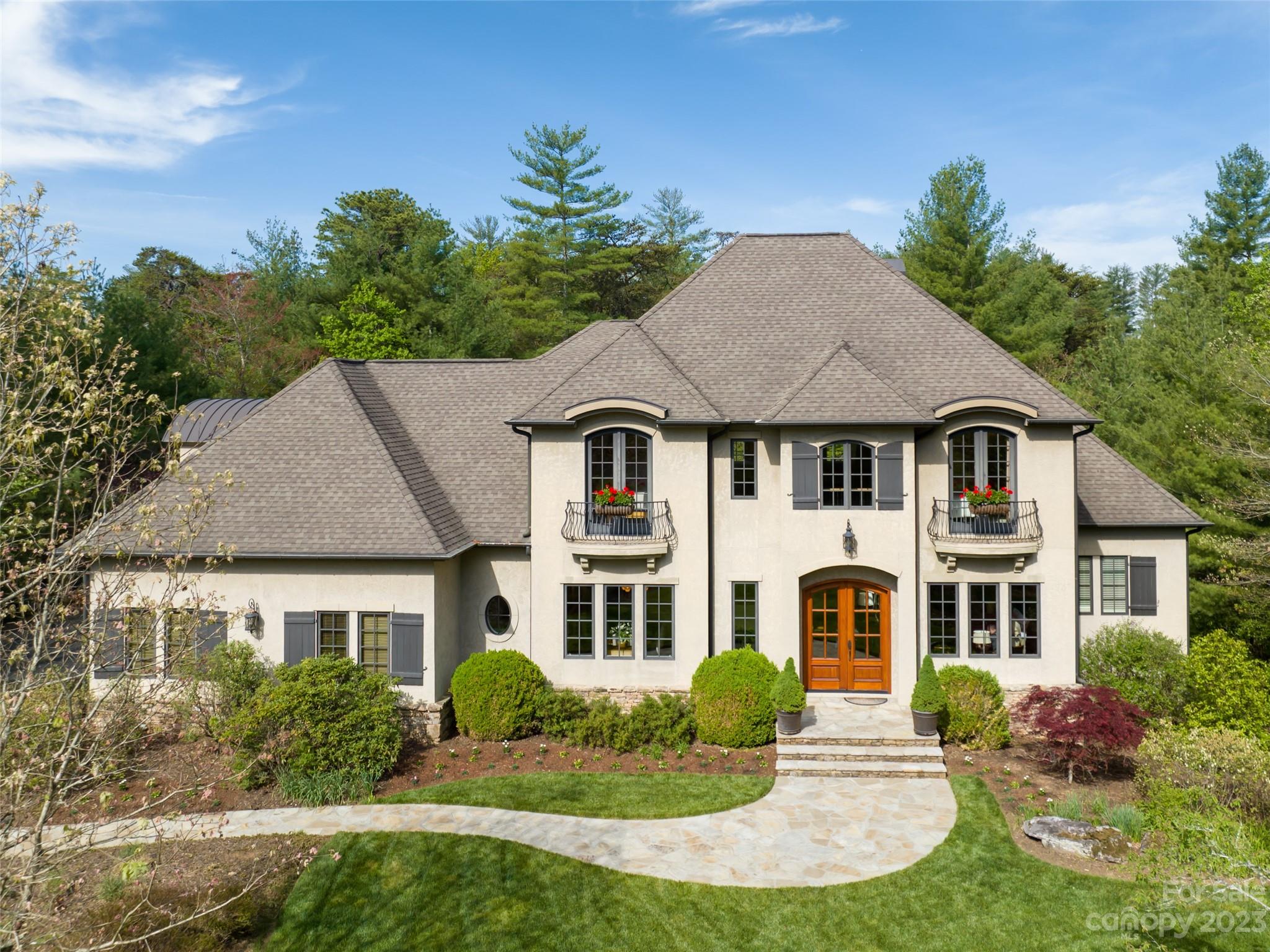 This European stone and stucco home is flooded with light from clerestory windows in soaring spaces. Ceiling heights up to 20 feet in the entry and great room transition to a beautifully designed floor plan by Architect ACM Design. Builder Hayward Johnson's attention to detail and quality is evident throughout - gorgeous moldings, a grand foyer staircase and a coffered ceiling in the study.  The spacious backyard outdoor living area adjoins the large, level grassy backyard - a rare find in The Ramble. Close proximity to Longmeadow Park. Enjoy all Ramble amenities - miles of trails, saline pool, the Living Well Center, tennis, pickleball and Bocce, Buckspring’s Cabin, parks, gated with 24-hour patrol. Owner is a licensed NC RE agent.