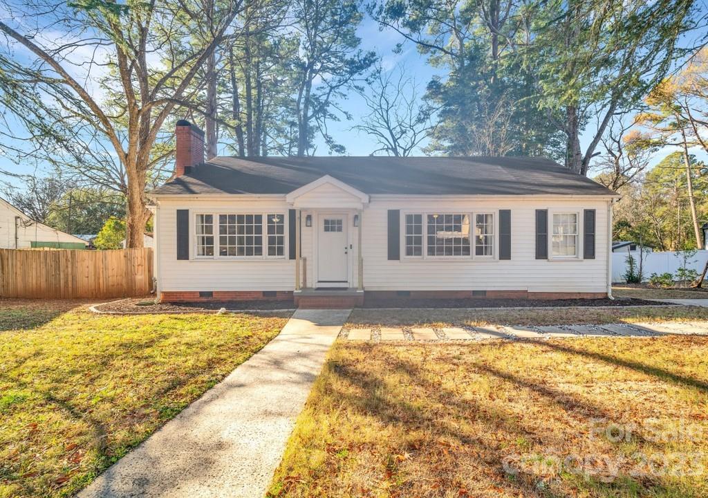 Welcome to your new home in charming York South Carolina! This adorable 2 bedroom, 2 bathroom home is in the heart of downtown. Right around the corner from all of the restaurants, shops and events that downtown York has to offer. Fresh paint and new LVP flooring throughout which ties in the newly remodeled fireplace. The dining room has gorgeous built in shelving and so much character.  A loft-ladder leads to a finished area upstairs, perfect for storage or creating a fun playroom! The cutest kitchen with stainless steel appliances and a huge window overlooking your fenced in backyard. Newly remodeled laundry room is located next to the kitchen and leads you out to your refurbished, oversized back deck and firepit area. Be sure to look at the Property Improvements Sheet for a list of upgrades!