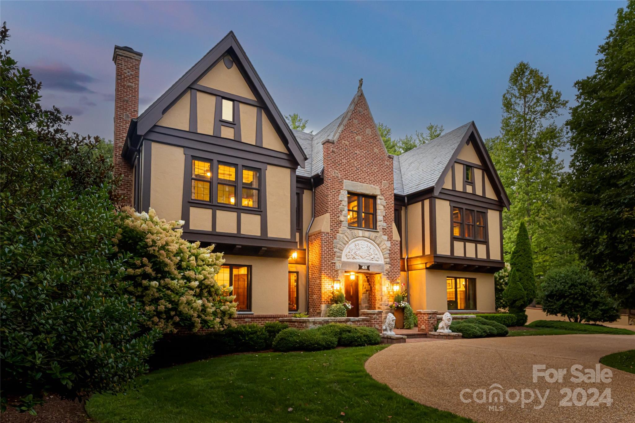 Experience extraordinary living in this thoughtfully designed custom European Tudor. Entering the home you will find Formal Library and dining with tasteful built in's. The open greatroom flows into the kitchen and hearthroom, creating a warm, inviting atmosphere in sheer sophistication.The primary suite opens to a walled secret garden, ideal for relaxation. Multiple terraces offer spaces for both entertainment and tranquility. The walk-out basement is perfect for entertaining, with a media room, wine cellar,  wet bar area, and great room that opens to a lower side yard with a wall fountain. The beautifully landscaped backyard features a fountain and gardens, providing a serene retreat. Incredible second living quarters cater to family or staff needs. Situated on an estate lot within a guarded and gated community, this home offers access to parks, trails, a wellness center, and a saline pool. Discover exceptional daily living, elegance, and comfort in this unique home.
