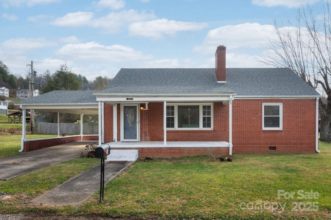 Charming full-brick, single-level home situated on a 0.37-acre corner lot in the heart of Bakersville. This 2-bedroom, 1-bath residence features a spacious living room with a cozy wood-burning fireplace, perfect for relaxing or entertaining. Large windows provide abundant natural light throughout the home, creating a warm and inviting atmosphere. The attached carport adds everyday convenience, while the generously sized, level lot offers plenty of outdoor space for gardening and recreation. A wonderful opportunity to enjoy comfortable, one-level living close to all Bakersville has to offer.