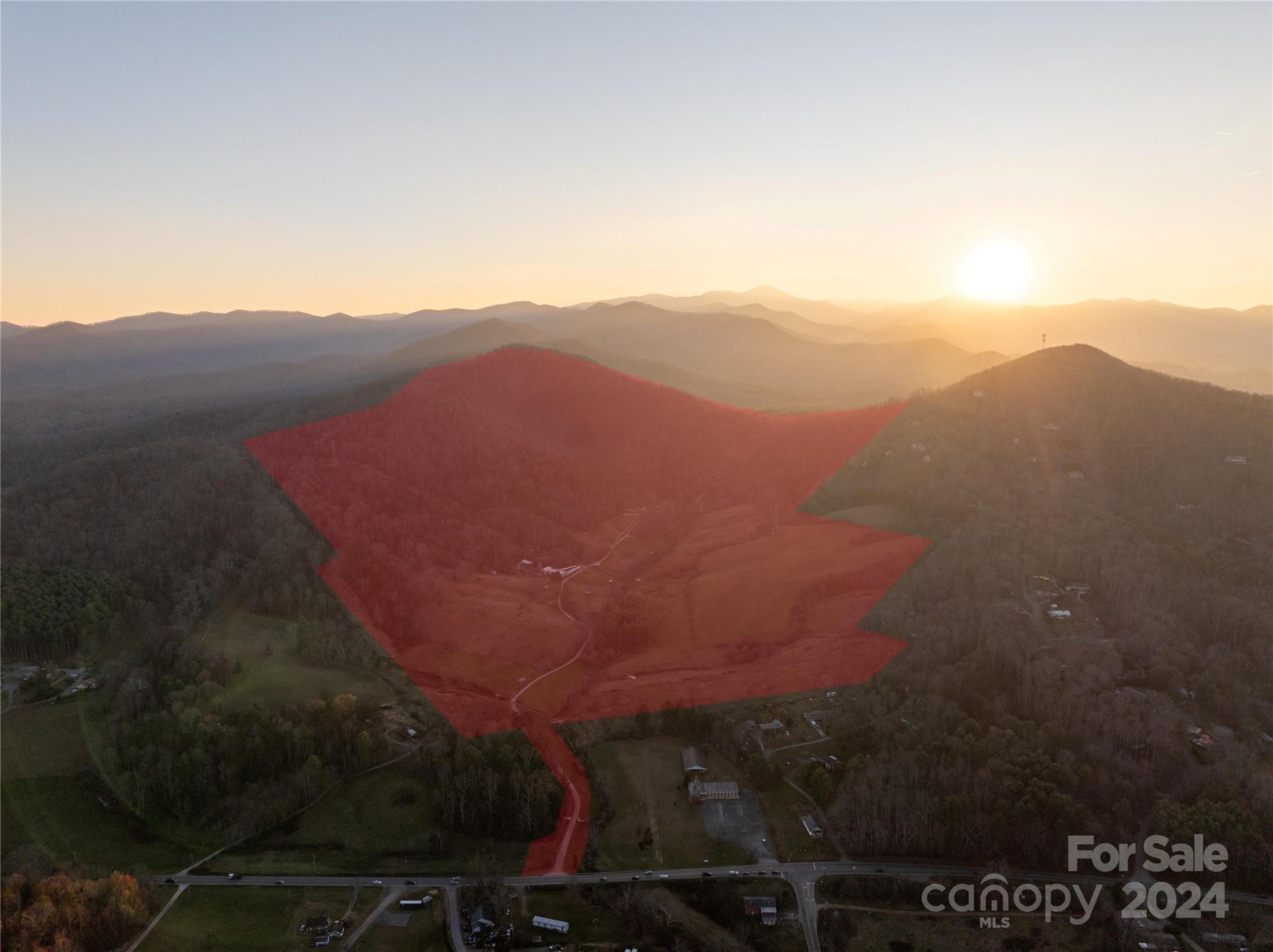 One-of-a-kind property with stunning long-range views of downtown Asheville and the Grove Park Inn. This 268± acre bucolic property is located off Sardis Road, just 1-mile from shopping and dining, making it an ideal opportunity for investors, a modern homestead or private family compound. The land features gentle, rolling pastures, woodlands, creek frontage plus a pond, a well-maintained 1947 home, two manufactured home sites, and an original homestead cabin with no value. Currently operated as a horse boarding facility, the ample pastureland offers six shelters. Note the horse barn needs some repair. This prime location would make a perfect luxury estate, residential/multi-home development with mountain views, and/or a health/wellness/spa retreat. The property is situated adjacent to 14,000+ acres of national forest offering direct access to some of the best hiking, biking and riding trails around. Only minutes to the Biltmore Estate, this location is the best of mountain living.