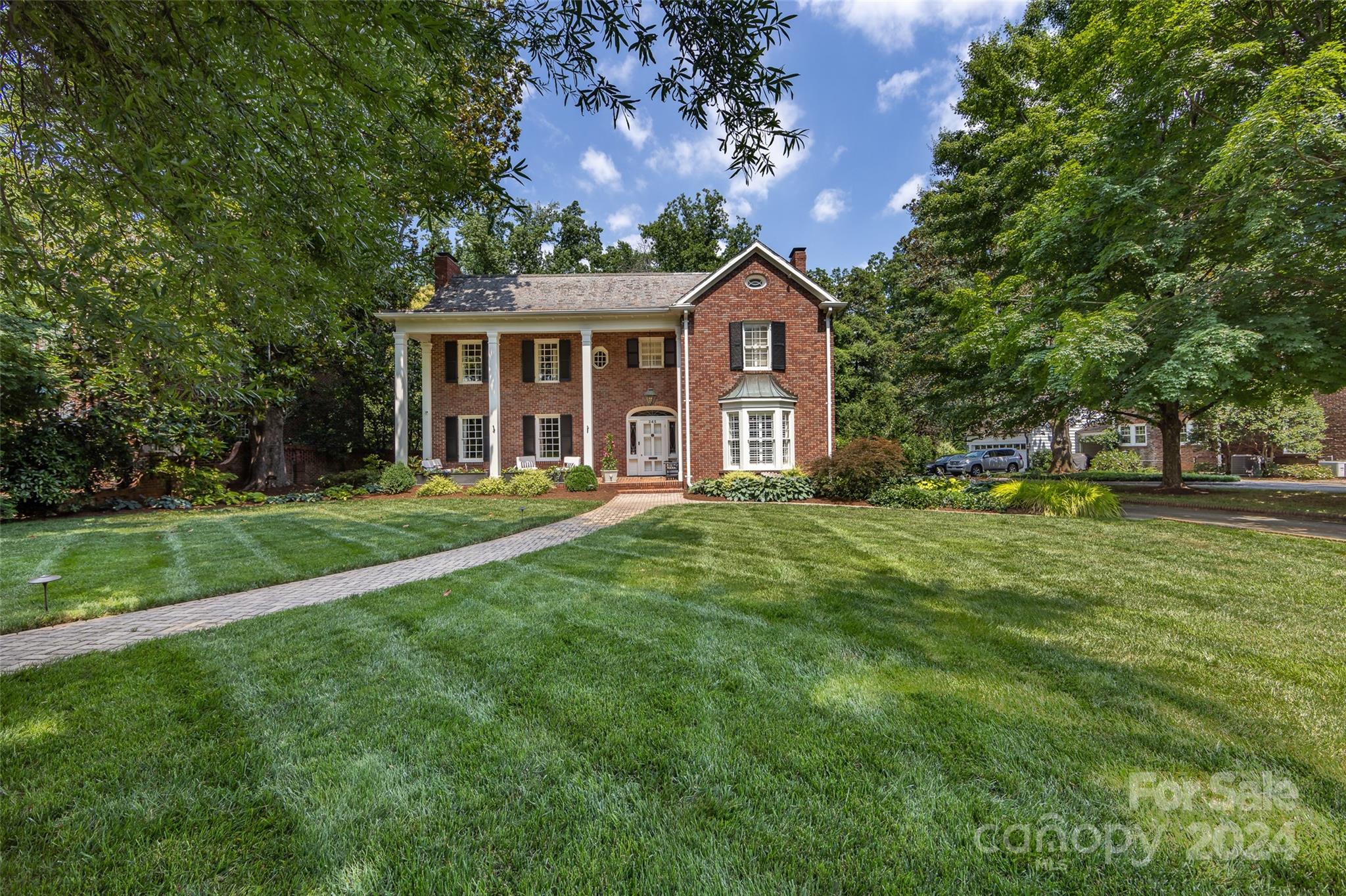 Completely refreshed, painted and move in ready. You will fall in love with this dream house in the heart of Eastover. Classic beauty features nine foot ceilings on the main floor, gorgeous hardwoods throughout, generous sized rooms perfect for entertaining and easy living.  Historic details have been preserved as the home has been updated over the years. Kitchen renovated in 2017 features gorgeous walnut island, subzero fridge, abundance of cabinetry. Spacious family room w fireplace, built ins, bay window overlooking private backyard.  Cozy library with fireplace, large dining room. Bar with icemaker/wine fridge. Full bathrooms renovated 2017 and 2022. 5 generous bedrooms (Second potential owner suite) up w 4 full baths (3 en suite). Luxury owners suite with fireplace and walk in closet.   Finished basement perfect for bonus room or playroom.  Covered side entry, landscape lighting, 2 car attached garage. In ground irrigation, elevator. Fabulous Eastover home and premier location.