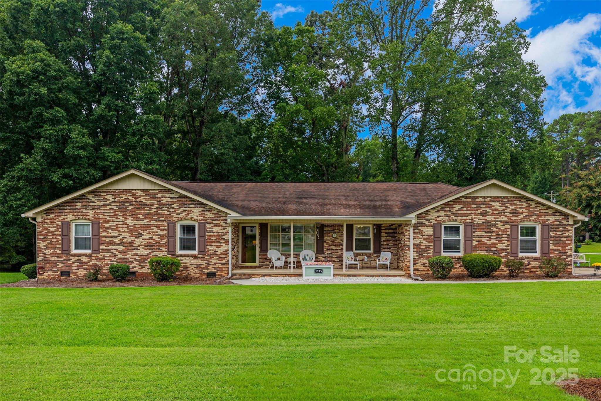 Welcome home to this classic brick ranch nestled on just over an acre in Clover, SC. This well-maintained 3 bedroom / 2 bath home also has a cozy sunroom/den (an un-permitted addition) and an incredible garage with cabinets and a storage room.  The yard has been meticulously kept and includes a shaded swing. There is a great front porch with a patio out back with a natural gas grill that conveys with the house!  In addition to the house there is a large shop complete with it's own driveway and garage doors and stone paver pathway to the house.   Lots of extras including gutter guards, tankless water heater, an 8x12 shed, durable composite flooring in the garage and laundry/mudroom. 

Don't wait to see this well maintained, one of a kind gem conveniently located close to local schools, shopping, and dining.