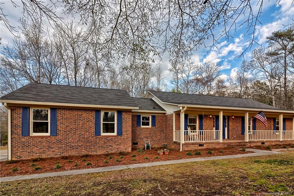 2.73 acres…NO HOA…Wooded Lot… Brick Ranch! Just 5.9 miles from Ballantyne…3br/2ba and office. A RARE find in Indian Land. Perfectly located in the quiet Ravenwood subdivision, this home offers all new flooring, granite and tile in both bathrooms, large attached 2 car garage and newly lined in-ground pool. Great landscaping tops off this home to make it a must see!