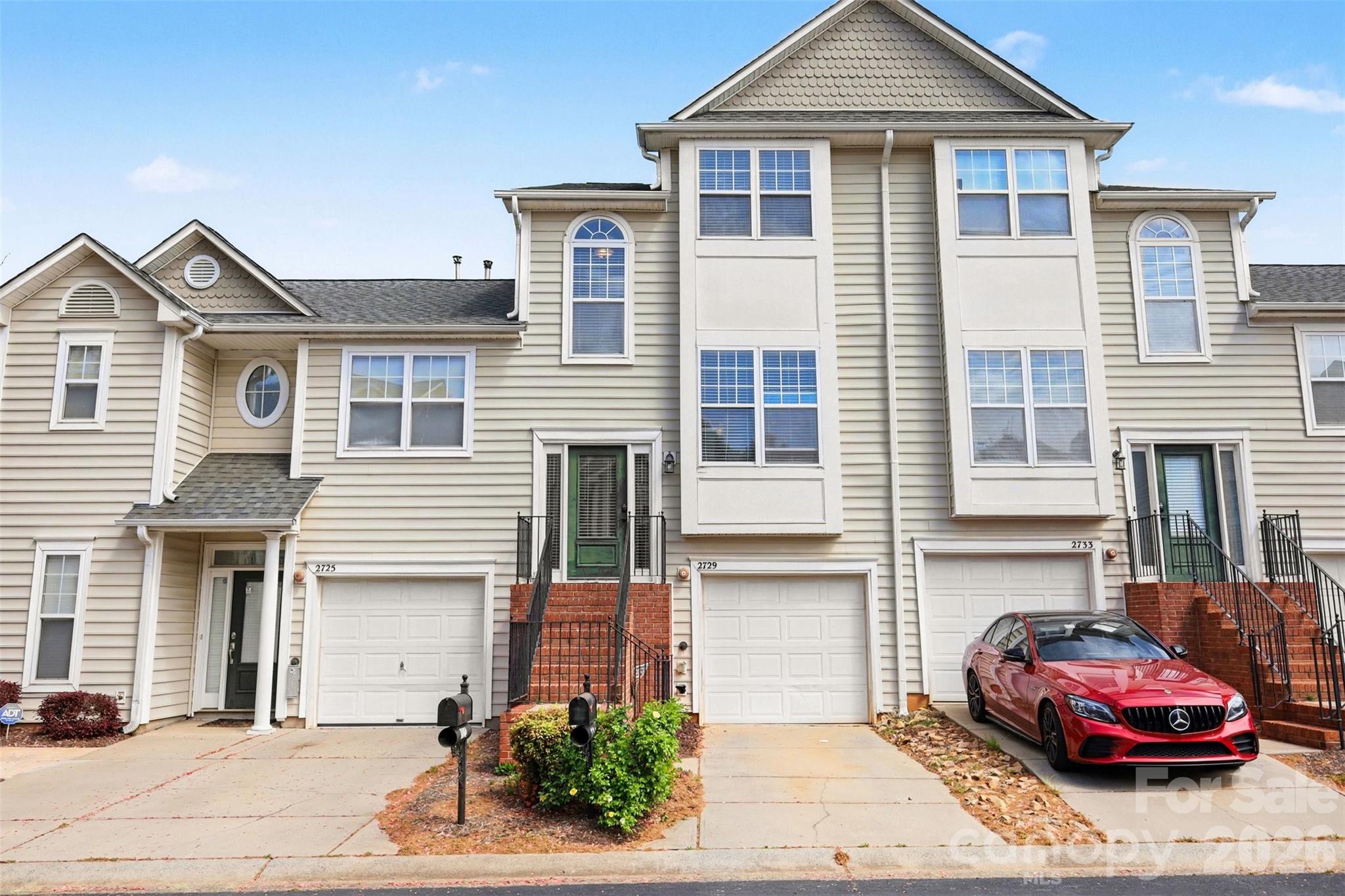 Elevated, low-maintenance living in a gated community—welcome to Avalon at Mallard Creek. This beautifully updated three-story townhome blends modern design with everyday convenience, ideally located just minutes from Uptown, major highways, and UNCC for effortless commuting and city access. The main level features a bright, open-concept living and dining space with a renovated kitchen and updated flooring, creating a clean, contemporary vibe that’s perfect for both relaxing and entertaining. Step out onto your private balcony with pool views—ideal for morning coffee or unwinding after a long day. Upstairs, the primary suite features a stylishly updated bathroom, along with an additional bedroom and separate full bath. The lower level adds versatility with a bonus/flex space suited for a private office, gym, or creative studio, along with a laundry area, garage access, and a covered patio for additional outdoor living. Enjoy the privacy of gated living with walkable access to the community pool, and nearby shopping and dining. If you’re looking for a move-in ready home that fits your lifestyle, this one checks all the boxes. Schedule your showing today!