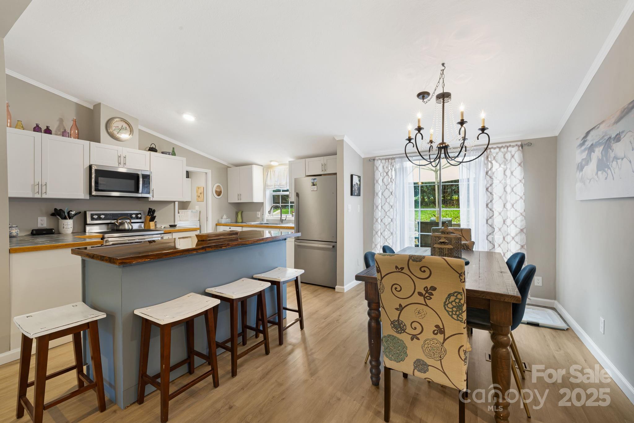 **IMMACULATE 3BR/2BA HOME IN FAIRVIEW - COMPLETELY UPDATED & MOVE-IN READY!**
Every inch of this home has been thoughtfully updated and beautifully finished. Step inside to a bright, airy layout featuring new vinyl flooring, vaulted ceilings, and gorgeous tile countertops in a dream kitchen that boasts white cabinetry, a large center island and sleek double sink. High-end lighting and ceiling fans add comfort and class throughout. Primary suite features double vanity and walk-in closet with a sliding pocket door—perfect for maximizing space. Two additional bedrooms feature large walk-in closets and can each comfortably accommodate king-size beds. Outside, enjoy a welcoming new front deck, expansive back deck, fresh landscaping, and two storage buildings. Minutes from Turgua Brewing, Whistle Hop Brewing, Asheville & more!