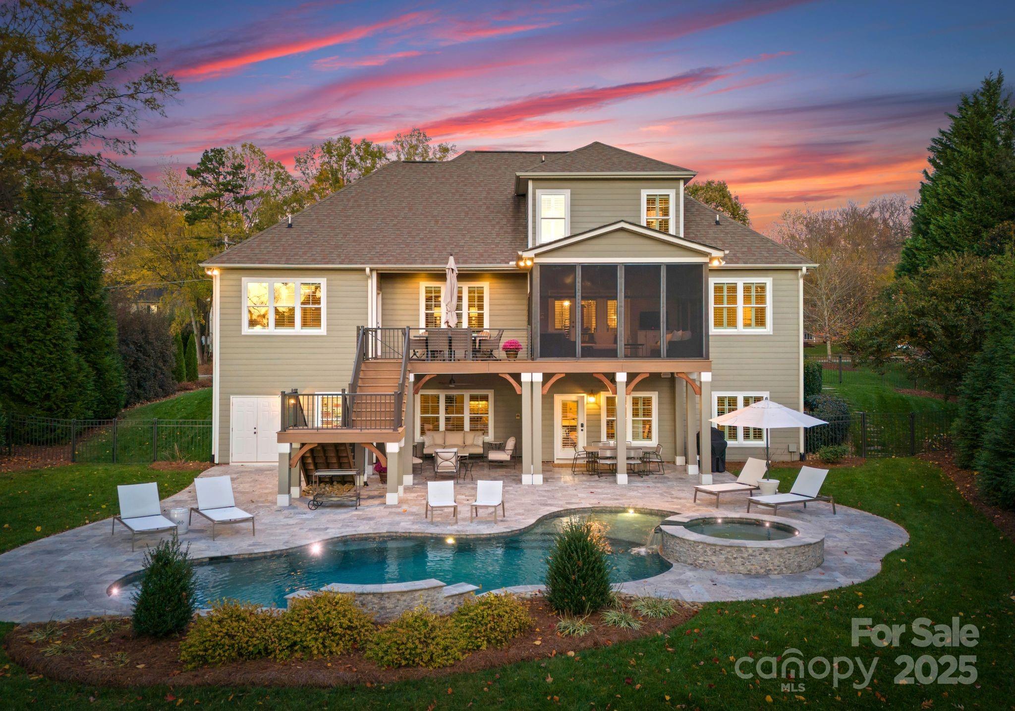 Waterfront under $3M! Enjoy complete serenity and thoughtful design from this exceptionally maintained water-access home. Nestled on a private .78-acre waterfront lot, the property provides the perfect blend of luxury and convenience. The heart of the home, the stunning kitchen offers modern finishes, ample cabinetry, and eat-in breakfast area ideal for casual meals. Sip morning coffee on the screened-in porch or dine al fresco on the terrace perfect for year-round enjoyment. The main level primary suite with spa bath and walk-in closet offers a peaceful retreat. The expansive basement designed for entertaining boasts an office/bedroom, additional storage & oversized workshop. The backyard, a true oasis complete with heated saltwater pool and relaxing spa, wonderful for unwinding after a long day. Lakeside, savor leisurely afternoons on the water from your dock, ideal for boating and fishing. Large 3-car garage, located just steps to Birkdale Village, groceries, restaurants, and more!