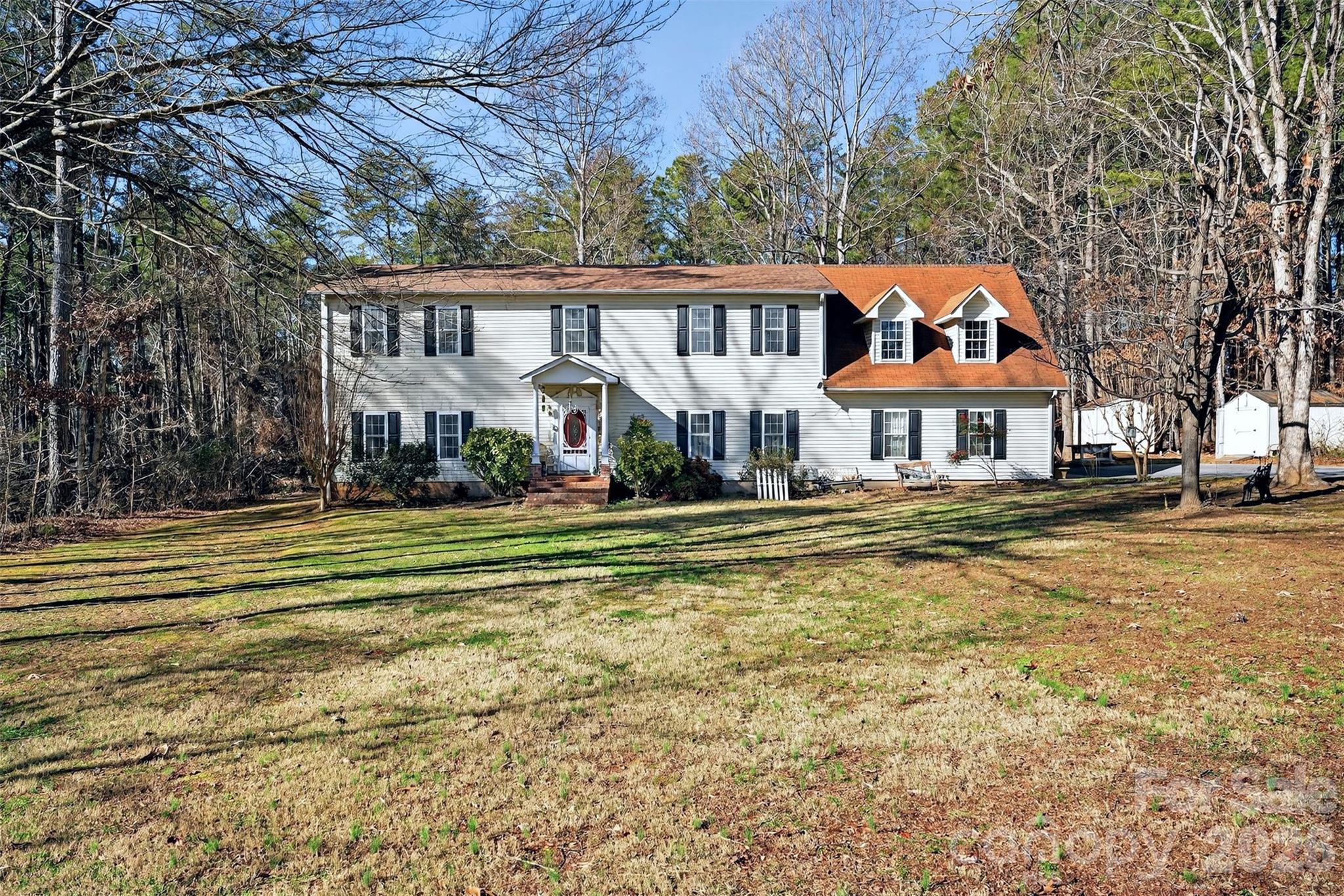 *Motivated Seller*

Beautiful 4 bedroom, 2.5 bathroom home that sits on over 4.5 acres of private land yet is located just a short drive to Columbus, Tryon and Landrum and is only 5 miles from the Tryon International Equestrian Center. This home features two levels with the main level featuring two separate living areas, one complete with a gas fireplace, a large kitchen, a great formal dining room, a 1/2 bath and access to a great rear deck that overlooks the private backyard. The upper level contains four spacious bedrooms complete with large closets in each of them. The upper level also contains two full bathrooms, including a large primary bathroom featuring separate tub and shower and a dual vanity. Above the attached two-car garage, you will find an addition completed in 2005 that contains a large bonus room that would be perfect for a variety of uses including another living space, bedroom or extra storage. The home also has two separate HVAC units for each level with one being replaced in 2025. A new roof was installed on the home in 2025 as well. Sitting on this acreage gives someone the ability to maintain their privacy with the wooded areas or they could choose to clear some of the wooded area to showcase the mountain views that are available. There is enough space where a small hobby farm could also be a possibility. Call to schedule your showing today!