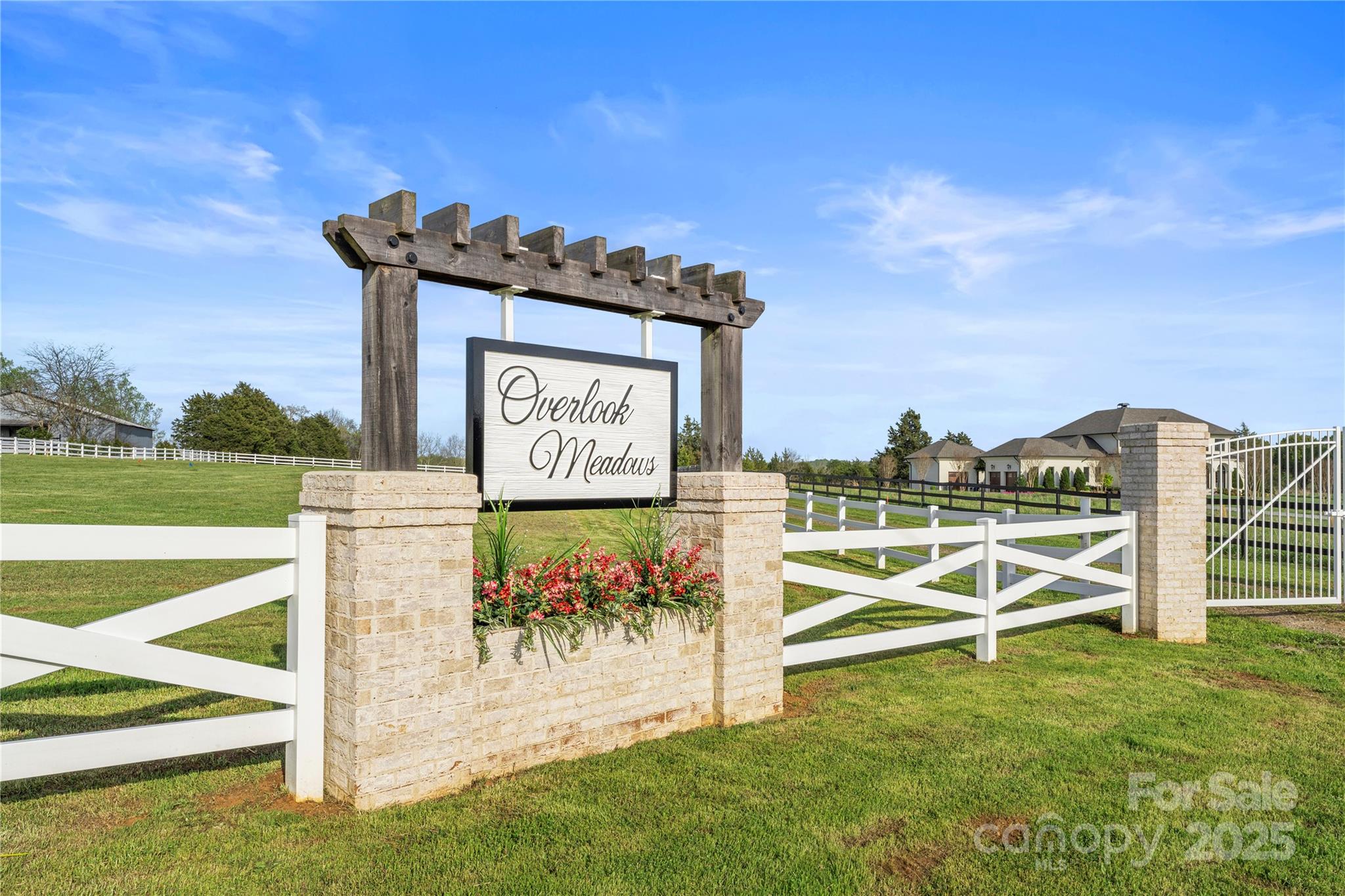 Discover the perfect blend of privacy, space, and convenience at Overlook Meadows—a private, gated enclave just minutes from downtown Davidson and Mooresville, and only 30 minutes from Charlotte. This 10-acre parcel (Lot 2) is set back along a private drive, offering an impressive sense of arrival and exceptional seclusion.

Ideal for an equestrian estate or gentleman’s farm, the property features gently rolling terrain, open fields, and tranquil vistas—providing ample space for pastures, barns, and riding areas. With a non-expiring recorded 5-bedroom septic permit and buried electrical service already in place, the lot is thoughtfully prepared for your custom vision.

Situated across Iredell and Rowan Counties, the designated home site lies within the Iredell school district, combining a desirable location with serene acreage. Whether you envision a refined country retreat, a modern estate, or a private equestrian haven, Overlook Meadows offers a rare opportunity to create a legacy property that embodies elegance, nature, and timeless appeal.