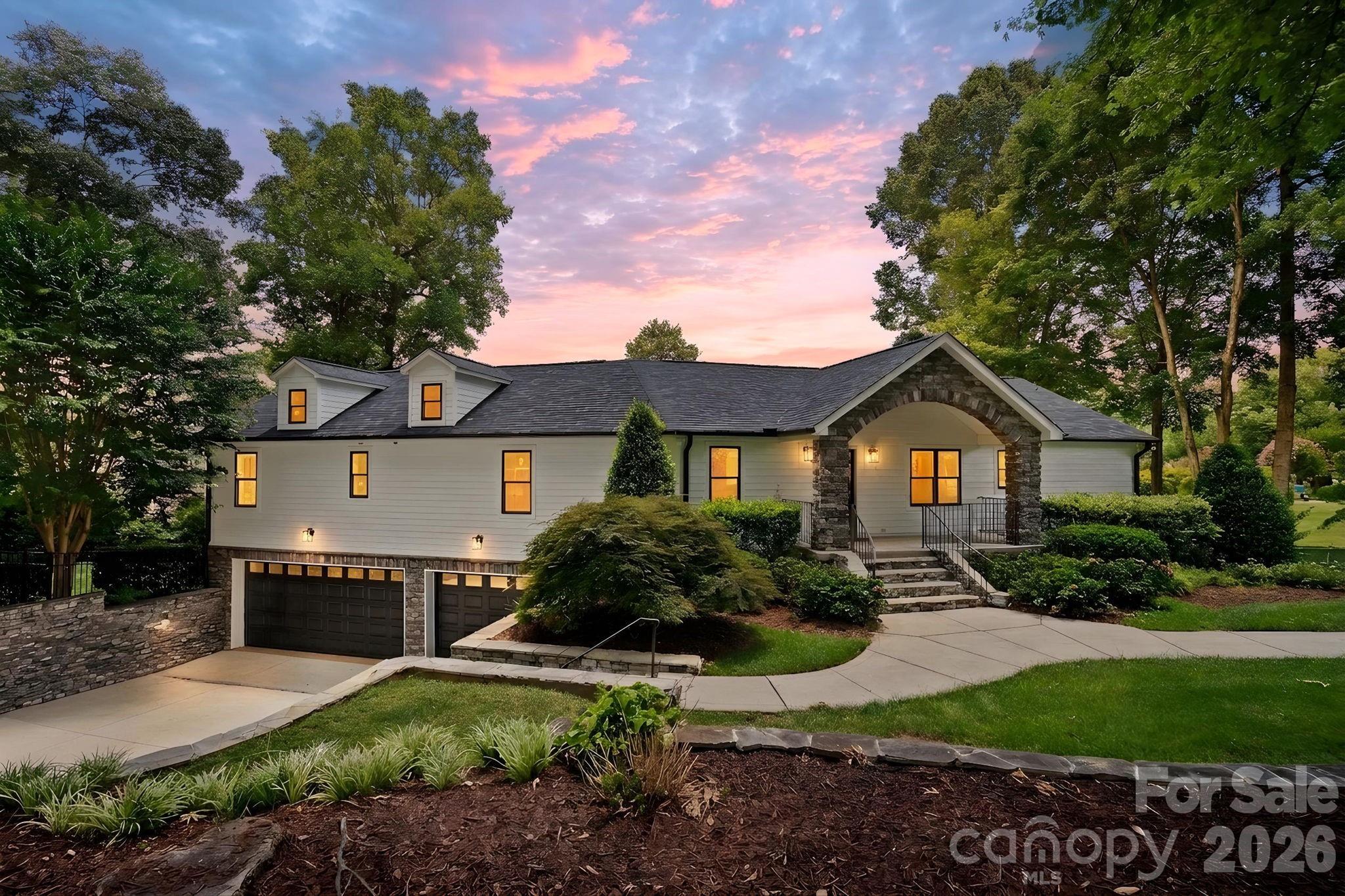 Step through the front door and experience the stunning views of Lake Norman that instantly create the feeling of a lakeside retreat. Nearly every main living space is designed to capture the water, offering a seamless blend of comfort, luxury, and breathtaking scenery. The gourmet kitchen equipped with Bosch appliances flows effortlessly into the living room with a fireplace and adjoining sunroom with a second fireplace, creating multiple inviting spaces to relax or entertain—all with beautiful lake views. The main level also features two spacious primary suites - one with yet another fireplace - offering comfort and privacy for owners and guests alike.
The fully finished walk-out lower level includes two additional bedrooms, a full bathroom, a spacious recreation room, and access to both a covered patio and an adjacent covered screened patio. The screened patio features retractable phantom screens for protection from the elements without obstructing the amazing view! Laundry areas on both levels add convenience, while the full bathroom just inside the garage is the perfect place to rinse off after a day on the lake. Extensively renovated since 2022, this exceptional waterfront home is tucked away in a protected cove, offering calm waters while still enjoying expansive lake views. The private dock with an upper sun deck provides the ideal setting for boating, swimming, or simply soaking in the Lake Norman lifestyle. Conveniently located in a peaceful Terrell community, just minutes from Mooresville and Sherrills Ford, you'll enjoy easy access by either boat or car to popular waterfront restaurants, marinas, shopping, and dining. This is a rare opportunity to own a thoughtfully renovated, one-of-a-kind, waterfront retreat in a tranquil setting where every day feels like vacation!
