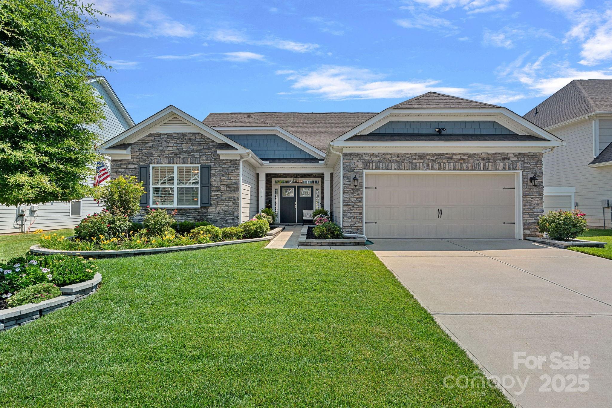 Beautifully landscaped 1.5 story home in Avondale. The open floor plan has 11’ ceilings on the main level and is filled with natural light. Spacious great room, with a gas fireplace and built-in shelving, flows into the dining area and the well-equipped kitchen. Featuring a gas cooktop, double ovens and quartz countertops, the kitchen also has a breakfast area and pantry. The primary bedroom has a tray ceiling and the ensuite bathroom has two sinks and a large shower. Two additional bedrooms share another full bathroom on the first floor. Crown molding and LVP floors throughout the main level living and bedroom areas. Upstairs is a 4th bedroom, 5th bedroom/bonus room and a full bathroom. Plantation shutters throughout the home. Excellent storage and custom shelving. Drop zone off the garage. A covered & extended stamped concrete overlooks the immaculate lawn and landscaped beds. Convenient Indian Land location and great neighborhood amenities!