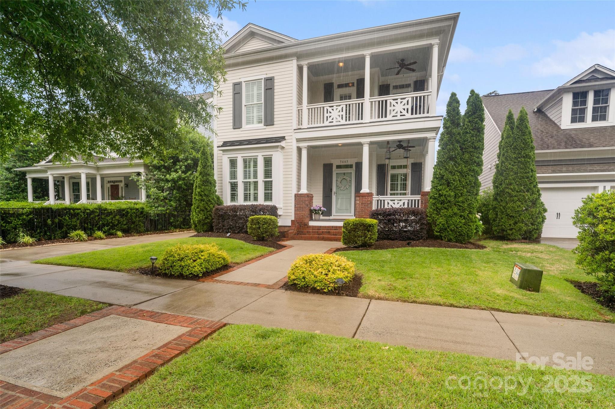 Charming Southern Double Front Porches Await! Don’t miss this beautiful home in sought-after Baxter Village, nestled in a quiet section of the neighborhood that backs to woods. Step inside to an inviting open-concept floor plan that connects the living room, kitchen, and dining area—perfect for everyday living and entertaining. The spacious primary suite is conveniently located on the main floor. Upstairs, gleaming hardwood floors extend through the hallway into a bonus room. You'll also find a secondary bedroom with a private ensuite, plus two additional bedrooms and a full hall bathroom. Enjoy outdoor living with a large covered back porch, fully fenced yard, complete with an electric driveway gate for added privacy. A detached two-car garage completes this exceptional home. As part of Baxter Village, you’ll have access to amenities including two pools and clubhouses, tennis courts, walking trails, pocket parks, & more, all within easy reach of shops, dining, & top-rated schools!