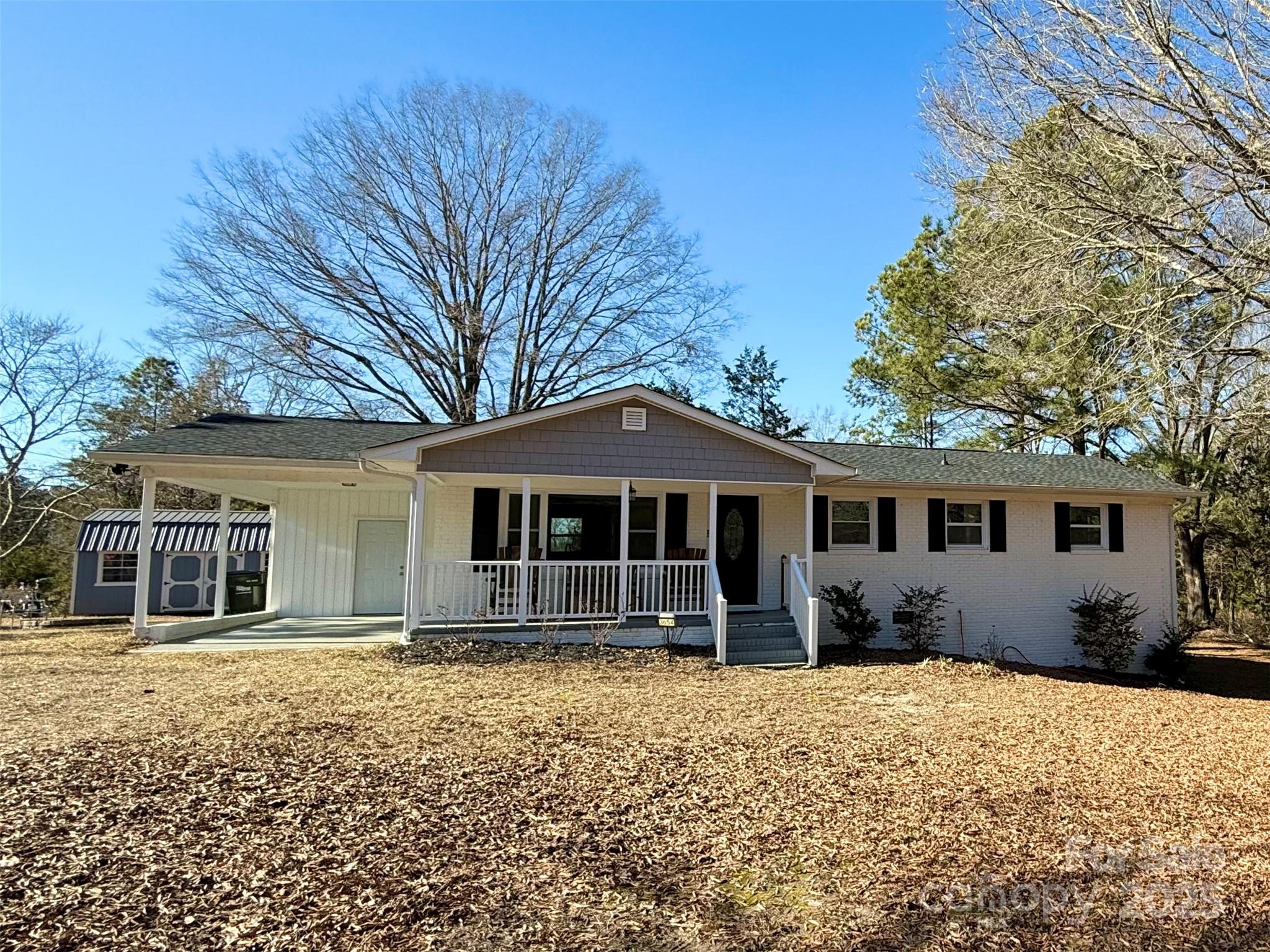 Discover this beautifully renovated all-brick ranch set on a sprawling 2.54-acre lot that offers privacy and tranquility, with the home situated well back from the road. This 3-bedroom, 2-bathroom home features a bright, open floor plan perfect for modern living. Enjoy peace of mind with major updates including a new roof, water heater, and HVAC (2023).  The spacious kitchen is equipped for all your culinary needs, and the new large exterior storage building provides ample space for projects and organization. Included in the sale are the refrigerator, washer, and dryer, making this home move-in ready.  Experience the perfect blend of comfort and style in this charming home. Don’t miss out—schedule your showing today and make this Lancaster gem your own!
