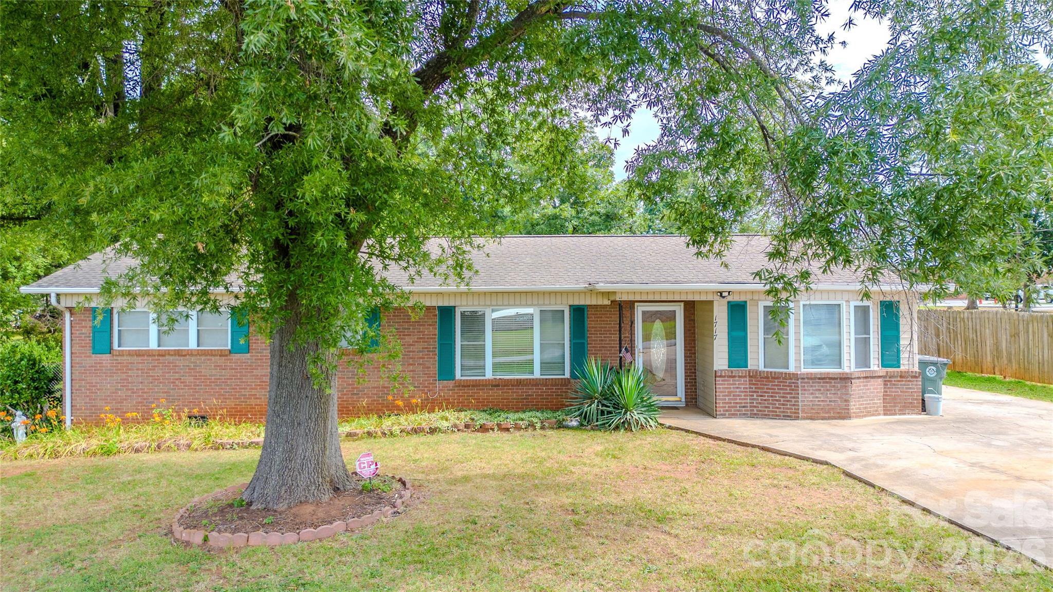 Prime Location! Conveniently located with easy access to major highways, including I-40, along with shopping, dining, everyday amenities, and the YMCA gym for fitness and recreation, this charming 4-bedroom, 2-bath brick home offers comfort and functionality.

Inside, you'll find beautiful original hardwood floors, fresh interior paint, a spacious dining area, and a kitchen featuring sliding doors recently replaced. Both full bathrooms include tile flooring and newer toilets.

Enjoy the outdoor amenities, including a powered workshop, wire fencing suitable for small animals or garden use, and a peaceful stone bench seating area perfect for relaxing.

A wonderful opportunity to own a well-maintained brick home in a desirable central location!

Property sold as-is. Don’t miss out—schedule your showing today before it’s gone!