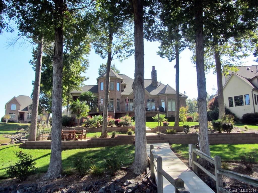 Prestigious living awaits in this 3 bedroom, 3.5 bath custom home in Joslin Pointe, Rock Hill's only gated waterfront community! Master on the main, plus 2 bedrooms & a bonus upstairs. 2-story living room with fireplace & gorgeous views, custom kitchen with granite, formal dining & so much more. Desirable waterfront lot with dock & boat lift, close to community pool, clubhouse & beach area!  Enjoy Lake Wylie living in all seasons!