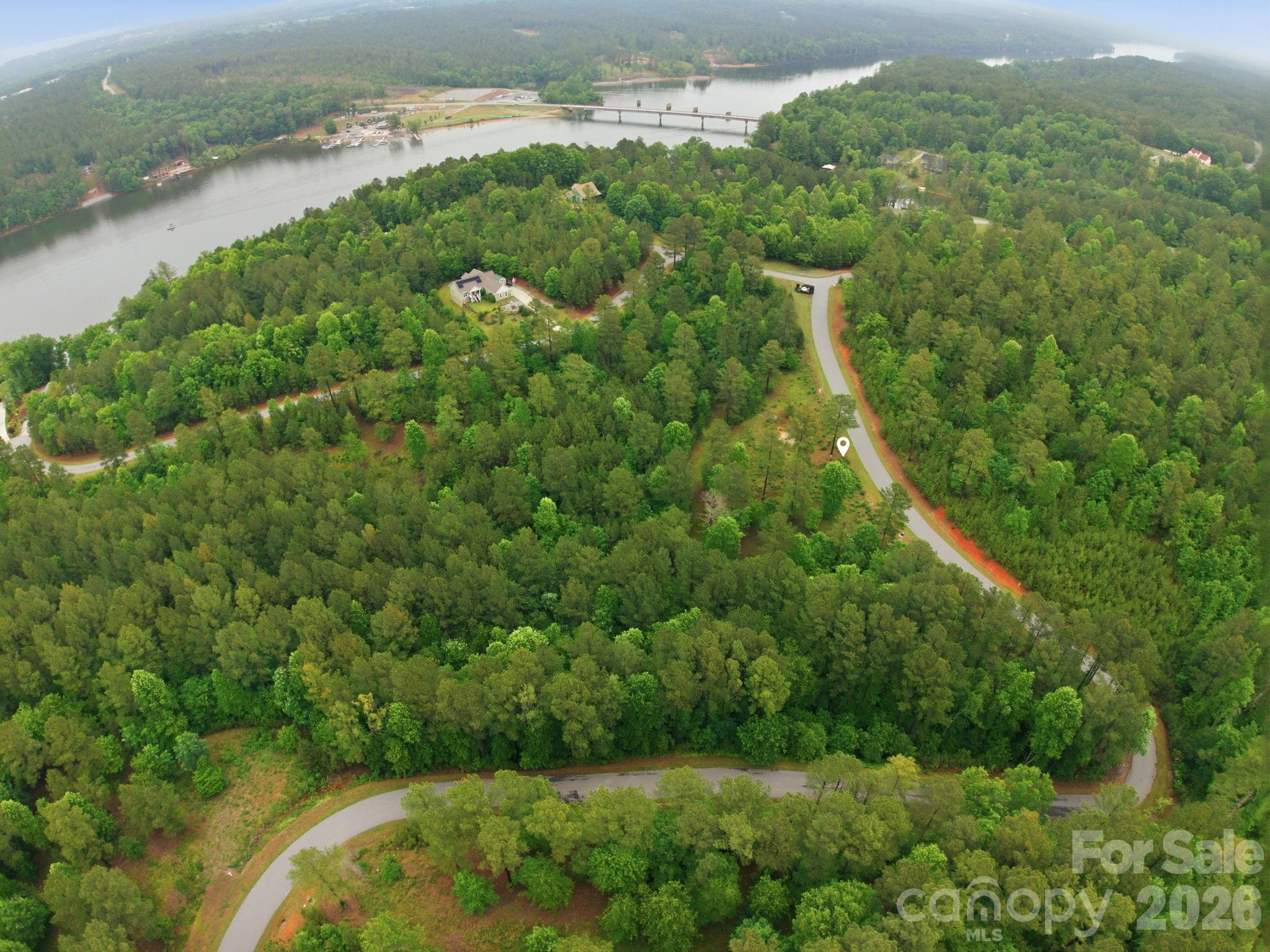 Tucked away in the peaceful foothills of Burke County, this beautiful 2-acre homesite offers the perfect mix of privacy, nature, and convenience. The front portion of the property has already been cleared, giving you a head start on building your dream home, while the wooded backdrop creates a quiet, secluded setting. Located less than a mile from the public boat launch at Lake Rhodhiss, you’ll have quick access to boating, fishing, and lake days whenever you want. Priced below market value, this property is an incredible opportunity to build and gain instant equity!