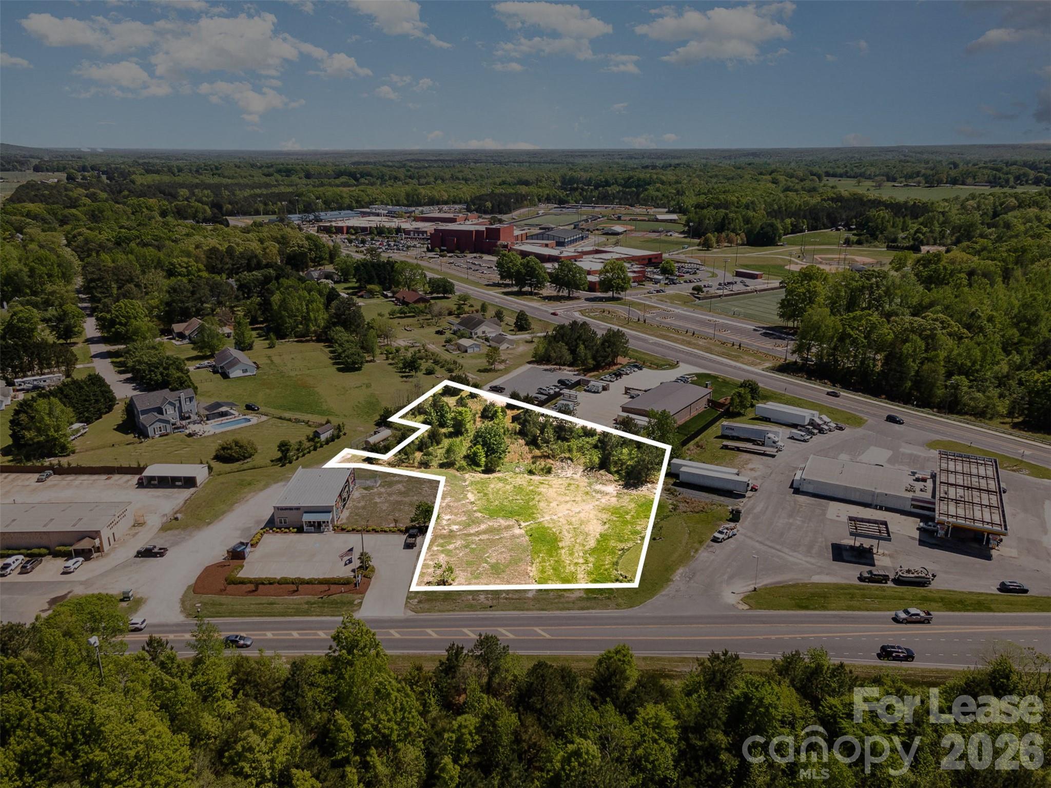 This 1.9-acre raw land lot offers a prime commercial ground lease opportunity at $98,000 per year. Situated along a highly trafficked corridor with excellent visibility, this site is ideal for a QSR (Quick Service Restaurant) franchise, retail, or service-based business. The property benefits from its proximity to Clover High School, growing residential neighborhoods, and the area’s rapid commercial development, making it a strategic location for businesses looking to capitalize on strong traffic counts and the area's continued growth.