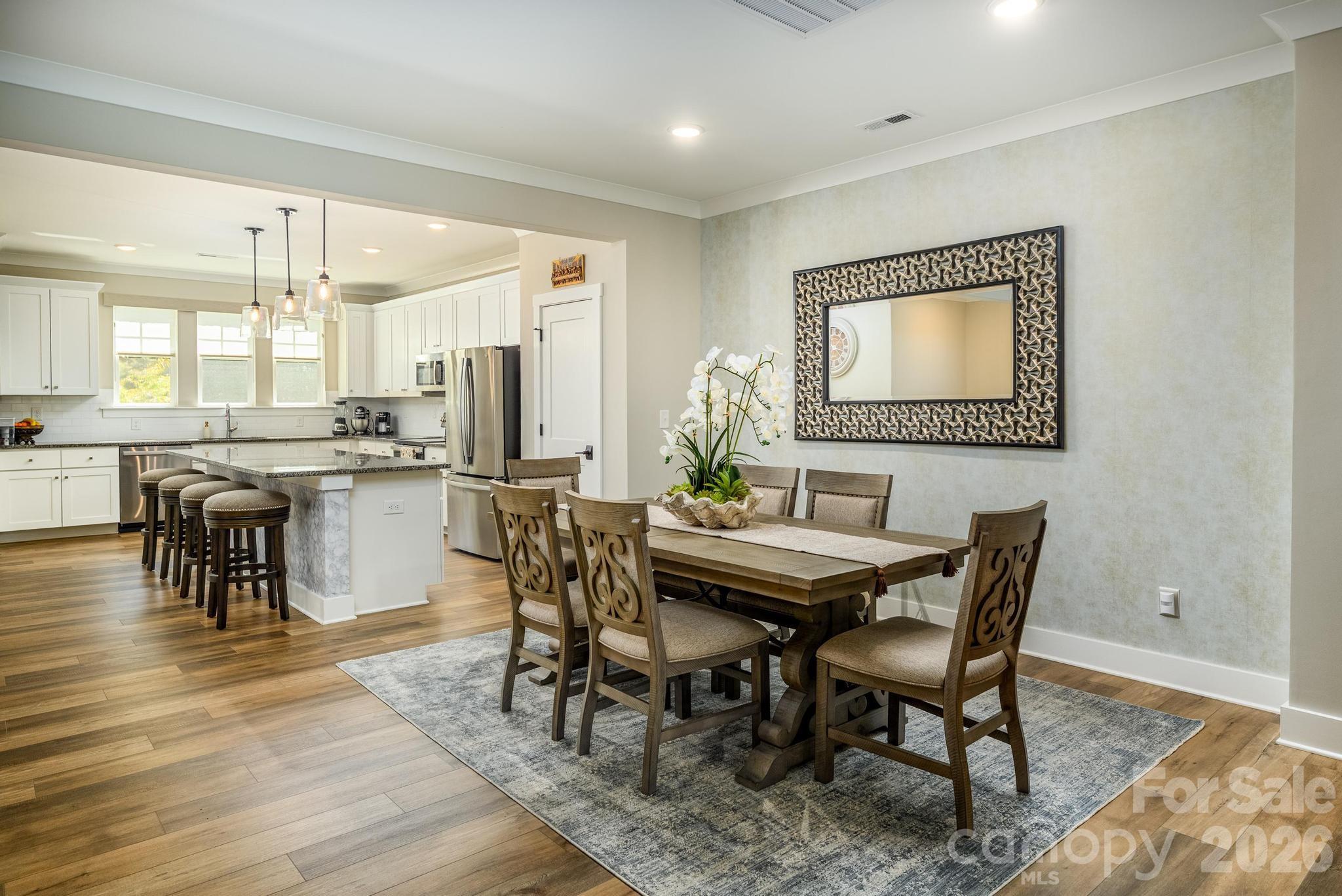 Beautiful 3 Bedroom 2.5 Bath Townhome w/LVP Flooring Throughout. Priced UNDER Tax Value & Seller is offering $5K towards closing costs with an acceptable offer. 3 Level w/Rear Entry 2 Car Garage, Mud Room & Storage Area In Basement, Huge Main Level Great Room, Elegant Dining Area, Gourmet Kitchen w/Large Eat-At Breakfast Island, Stainless Appliances, Granite Counters & Pantry, Half Bath, Sliding Doors Leading To Outside Deck Overlooking Dog Park, Upper Level Boasts Primary Bedroom w/Large Walk-In Closet, Primary Bath w/Double Sink Vanity & Oversized Walk-In Shower, Secondary Bedrooms w/Double Door Closets, Flex Area, Laundry Room & Additional Full Bath. Highly Sought After Location Surrounded By Trees Yet Within Walking Distance To Target, Restaurants, Shopping & Retail Stores w/Easy Access to I-77 & Award Winning Iredell County Schools.