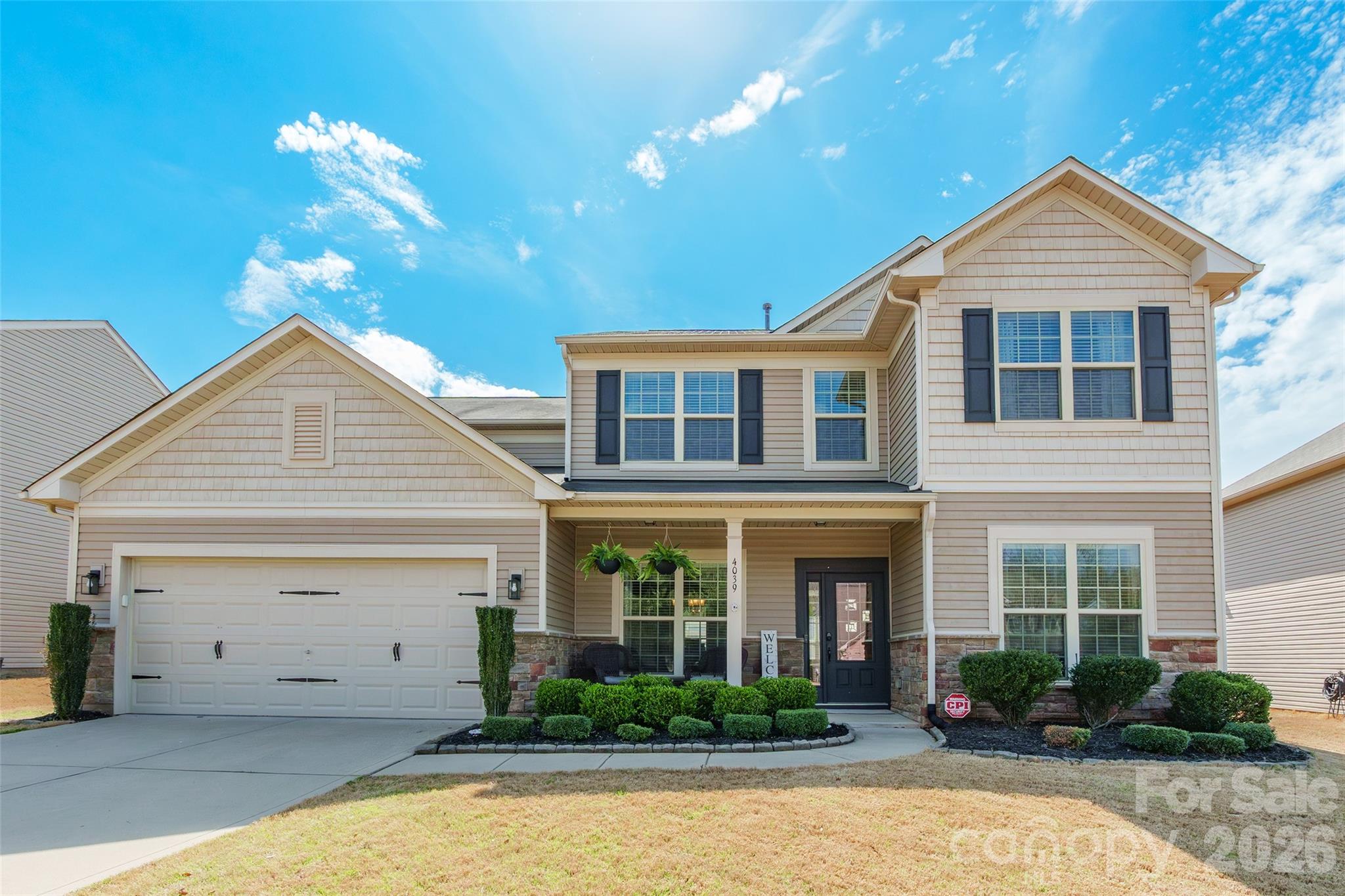 This stunning home in the desirable Audubon Lake community offers a blend of sophisticated living space designed for both comfort and organization. The interior has been beautifully refreshed with newer flooring throughout the main level and newer carpeting upstairs, ensuring a modern, move-in-ready feel. The open-concept main floor features an inviting foyer, a dedicated home office, a formal dining room, and a gourmet kitchen equipped with a butlers pantry. Functional luxury meets daily convenience with a custom drop zone that is sure to impress, walk in closets, keeping the home organized and clutter-free. This space flows seamlessly into a light-filled sunroom, which opens to a backyard perfectly suited for wonderful outdoor entertainment. Upstairs, you'll find four spacious bedrooms and a versatile loft ideal for a media room or play area. Practical amenities abound, including a 3-car garage capacity (via a 2-car garage with tandem space). Perfectly situated in Indian Land close to Ballantyne and Fort Mill. Zoned for Harrisburg Elementary. This home offers the ideal blend of luxury and convenience.