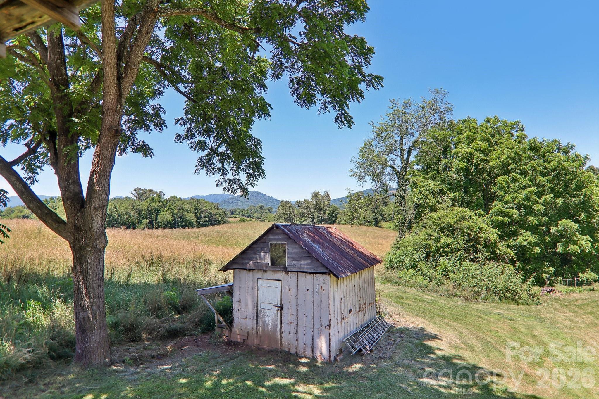 Stunning long range views from this property. 1945 build with newer metal roof and vinyl siding. City water and sewer. Large kitchen with dining area. Owner recently painted interior and replaced flooring in bedroom and bathroom. Flexible square footage use. NOTE: Previous owner removed a wall between 2 bedrooms and made one large bedroom. Easily convert back to 2 bedrooms. Bonus room between living room and dining room has closet and was used as a bedroom by owner, but no window in that space. Back deck and covered front porch. 2 sheds. One wired. Unfinished dirt basement. Excellent opportunity to secure an affordable fixer upper home with large lot and stunning year round long range views. Per town of Canton zoning I spoke with,  there is enough land to survey off an additional lot. Easy to do with water and sewer at street. Canton will allow an accessory dwelling if you want to keep one parcel. Structure must meet town of Canton guidelines and be no larger than 60% of primary home square footage. This lot really is special. Hemlock, views and blackberries lining back of lot. The home has been in same family 42 years. Stand alone oil heater in living room . So much space to garden or build. It's a rare setting. The home does need work and is priced accordingly. Easily convert back to 2 bedrooms
