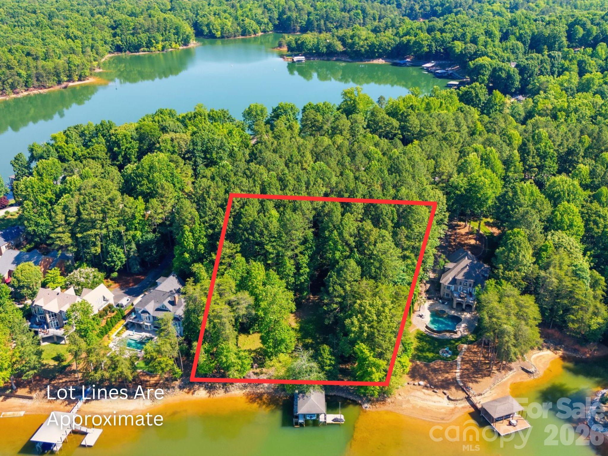 A rare chance to own one of Lake Norman's premier waterfront homesites. This exceptional 1.85-acre double lot in Troutman offers the perfect setting to build your custom waterfront estate with a private fixed dock, boat lift, and shoreline rip rap already in place. One of the property's most remarkable features is the breathtaking view across the water to Lake Norman State Park. With protected land directly across the lake, you'll enjoy a peaceful, natural backdrop that will remain undeveloped for years to come, creating a level of privacy and scenery that is increasingly difficult to find on Lake Norman. The expansive homesite provides endless possibilities for designing the home you've always envisioned. With 1.85 acres, there is ample space for a luxury residence, outdoor entertaining areas, and beautifully landscaped grounds while still maintaining privacy. Whether your vision includes expansive outdoor living spaces, walls of glass overlooking the lake, or a detached garage or guest house, this property offers the space and flexibility to bring it to life. Spend your days enjoying boating, fishing, paddleboarding, or simply relaxing from your private dock while taking in the peaceful surroundings. Conveniently located just minutes from downtown Troutman with easy access to Mooresville, dining, shopping, and major highways, this extraordinary waterfront property offers the perfect blend of privacy, natural beauty, and convenience. Opportunities like this are rare. Build without compromise and create a legacy property to enjoy for generations.