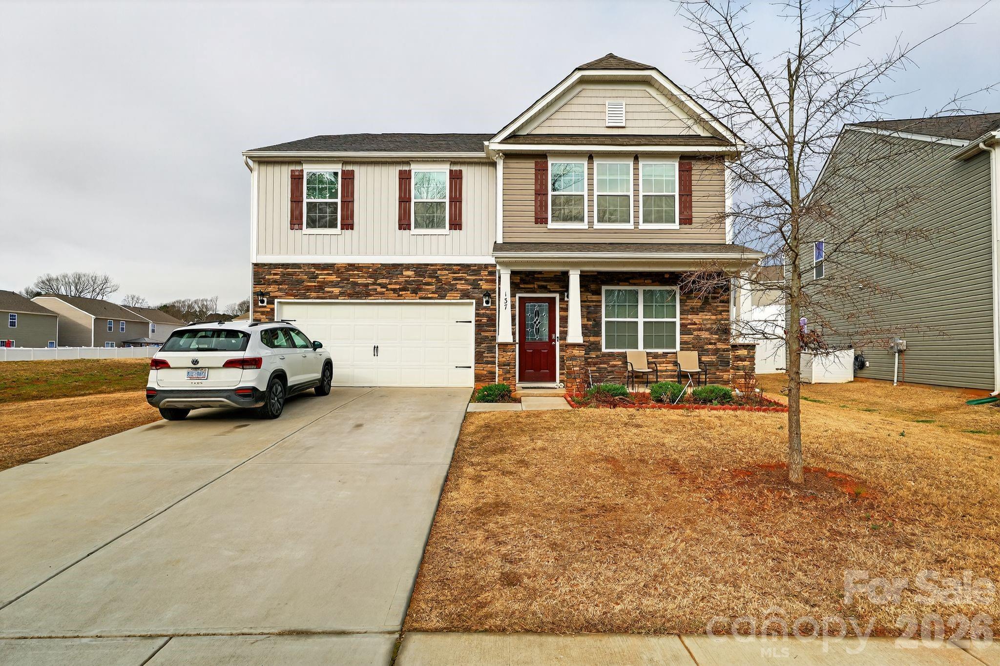 Only three years old and better than move-in ready, 137 North Ranney Way delivers the feel of new construction without the wait. This 2022-built traditional-style home in Mooresville's Sequoia Forest community offers four large bedrooms, 2.5 baths, and an open-concept layout designed for the way people actually live.The main level welcomes you with an airy, connected flow — the kitchen featuring granite countertops opens directly to the living area, making it easy to entertain or keep the household running smoothly. A convenient half bath rounds out the main floor.Upstairs, four generously sized bedrooms provide space for everyone, with two full baths and a dedicated laundry room right where you need it most.Out back is where this home truly shines. A covered patio extends your living space outdoors, overlooking a fully fenced yard enclosed by a vinyl privacy fence — the perfect setting for weekend gatherings or quiet evenings outside.A two-car attached garage, granite finishes throughout, and a gas range round out a home that feels fresh and complete. With a low $83/month HOA and easy access to Mooresville's dining, shopping, and Lake Norman, this location is as practical as it is desirable.Schedule your private showing today before someone else calls it home.