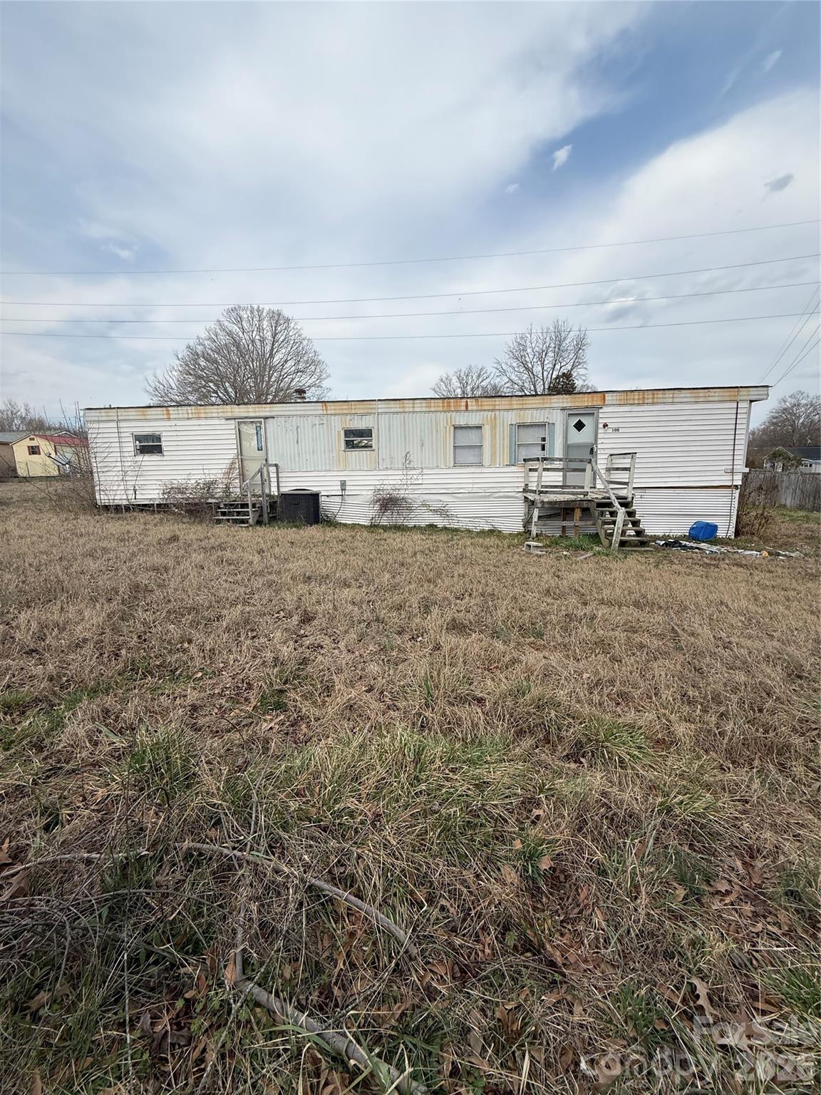 Great opportunity for investors or buyers looking for land with potential! This property features a 0.31 acre parcel with an existing mobile home on site. The mobile home is not permanently affixed to the land and is titled separately. The title is currently in the seller’s name, and will transfer at closing. 

The home will require significant repairs and is being conveyed as-is with no value assigned. It currently has no central heating or air (window unit only) and no appliances. The property was inherited, and the sellers have never occupied the home.

The property is zoned R-7 zoning district, which requires stick-built construction. If the existing mobile home is removed, it cannot be replaced with another manufactured home.

Whether you’re looking to renovate, remove, or build, this property offers potential for the right buyer. Buyers are encouraged to verify all information.


This property is also listed as land - see MLS#4352770 for additional details.