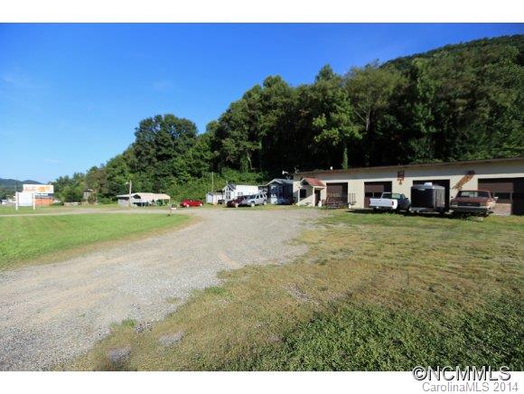 Don't miss this rare opportunity:  Fantastic 2+ acres with over 400+ feet of road frontage with city water and sewer with over 3600 sq ft of warehouse with three bay garage doors, and income from rented billboards. Many opportunities await, includes PIN# 8607-50-7015