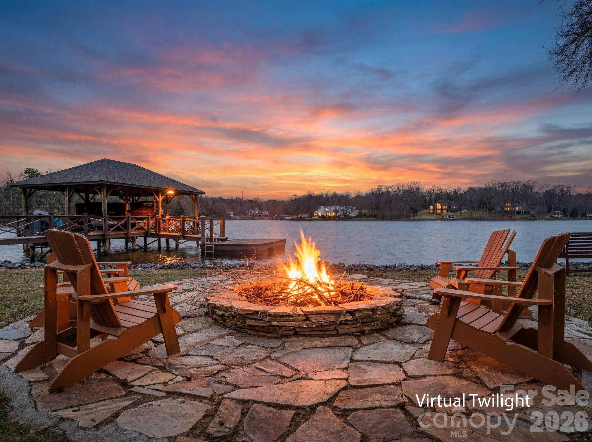 Truly, ONE OF A KIND! This Waterfront property not only features a gorgeous updated one-level home, but also a Guest house and a waterside "Boathouse". Situated on an exceptional RARE lot of over 1.6 acres, with BIG year-round water views. Tucked back from the main channel and wooded, offering exceptional privacy. A SC address and super close to NC. As you enter the main house, you are greeted with a great room that has a spectacular ceiling and exceptional views of the water, 3 bedrooms, 3.5 baths, flex space, kitchen perfect for gatherings. Brand new tankless water heater, roof (2025), sealed crawlspace, LVP flooring. Primary bedroom with ensuite, huge walk in closet and conveniently located laundry, with an additional location option for laundry as well. Two additional bedrooms. Drop zone that leads to the perfect "Man Cave" or could be an office, the possibilities are endless. Sip your coffee on the large screened porch with multiple views of the water. Grill out on back patio. 2-car oversized (28X28) garage. A separate guest house is also fully updated with a kitchen, living room, laundry, bed and bath. Perfect for guests, in-laws or parents. The waterside "Boathouse" adds a huge touch of fun and relaxation featuring an open game room area, built-in-beds, 3/4 bath, kitchen/bar, large covered deck to hang out and enjoy the water! A deep-water covered with boat lift and floating swim deck. Enjoy the waterside fire pit. Live paradise every day with this spectacular property! Great location with easy commutes to award-winning Clover schools, Charlotte Douglas Airport, Charlotte, Belmont and so much more. Schedule your showing to see this unique gem today!