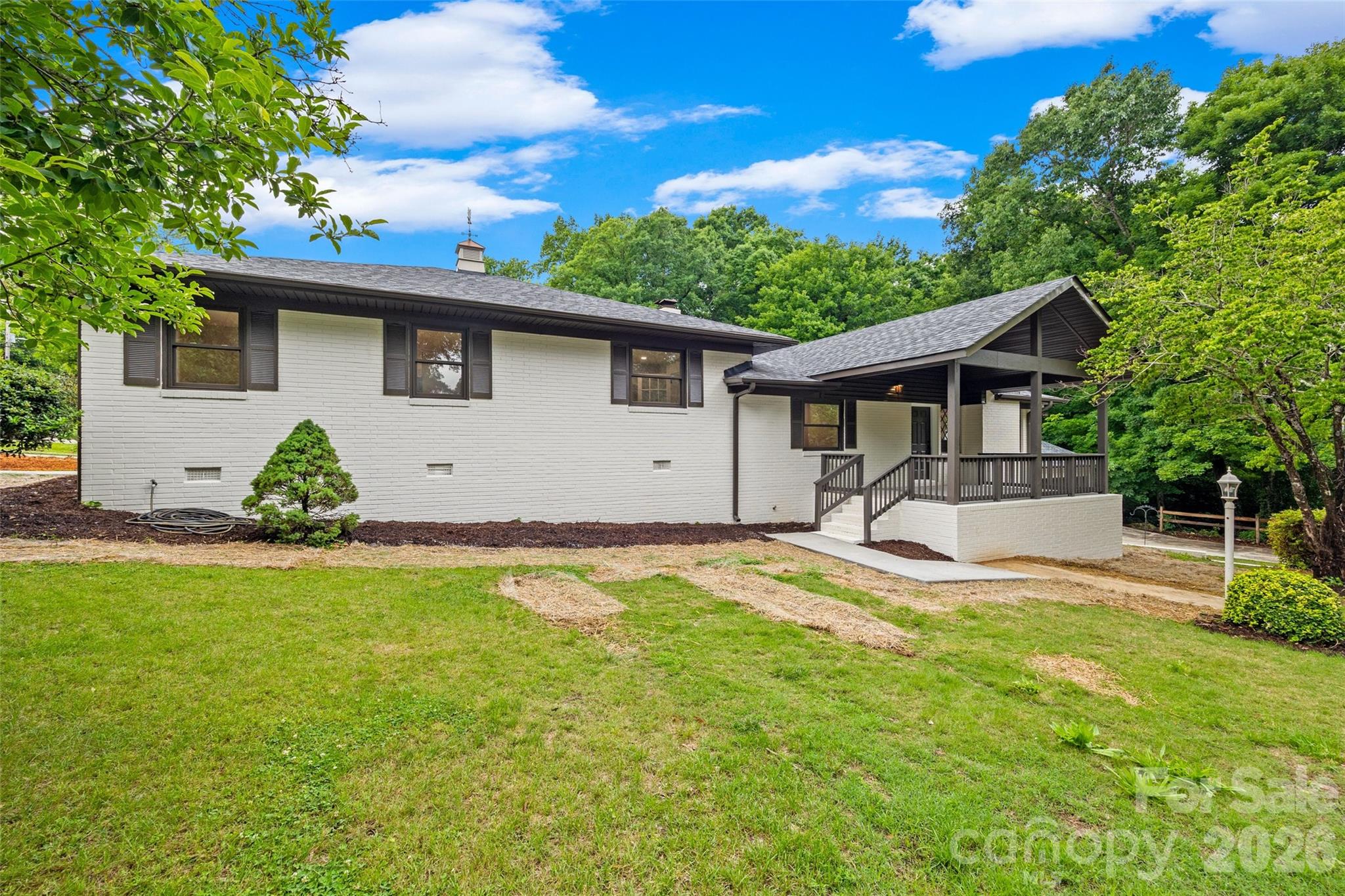 NEWLY RENOVATED IN CONCORD 3 MINUTES FROM DOWNTOWN!

Fully renovated brick ranch with a full walk-out basement, multigenerational living potential, and one of the most functional layouts you'll find anywhere in the area. 

Welcome to 434 Sunnyside Drive SE - a thoughtfully reimagined home where nearly every major component has been upgraded in 2026, blending the quality of 1960s construction that's becoming increasingly difficult to find with modern functionality and flexibility.

This is far more than a cosmetic renovation. Major improvements completed this year include: new roof, whole home rewire and upgraded electrical panel, new plumbing throughout, new windows, new ductwork to accompany the newer 2024 HVAC systems, reengineered floor-plan for better flow and function, covered porch addition, removal of overgrown trees, & more.  Permits were pulled for the project and available via cabarrus county and attached in the MLS for your agent to easily find.

The main floor has been completely redesigned for modern living and exceptional functionality, featuring a fully renovated kitchen with new everything: cabinetry, countertops, appliances, fixtures, and a way more functional workflow.  Initially shoved in a coat closet to lose socks and collect lint, a full walk-in laundry room was added to the main floor with designer tile flooring and more cabinetry, making everyone's least favorite chore more enjoyable. The main floor has a brand new half bath added for guests, a newly created primary ensuite bathroom, and a guest suite with its own attached bathroom that could serve as a second primary suite. You will find newly refinished hardwood floors and designer tile throughout the entire main floor as well as new windows, drywall, and paint. The sunroom has been refreshed with new windows and new tile to brighten the space and live up to sunnyside drive's name.  The main floor layout is configured so that every bedroom has direct access to their own bathroom, and guests have their own space as well. This created two separate suite-style bedroom setups on the main floor, offering incredible flexibility for guests, multigenerational households, and longterm comfort.

Downstairs, the fully finished walk-out basement opens up even more possibilities offering 2 additional bedrooms, a full bathroom with walk-in shower, a full second kitchen, full second laundry room, private exterior access, and zero-grade entry with handicap accessible setup potential. Whether you need space for extended family, independent living quarters, guests, or future income potential, this layout is uniquely equipped to handle it all.

Outside, the property continues to impress with an everlasting full brick exterior that has been freshly painted, brightening up the corner of Sunnyside and Blume St. The addition of the large covered front porch adds architectural interest, shelter, and a cozy place to hang on a nice day. Don't worry - you still have the sunroom for those good and bad weather days.  The corner lot provides dual driveway access from Sunnyside and Blume for exceptional parking a flexibility, and the oversized detached 3-car garage is just another benefit this stunning property offers.  The backyard is level, cleared, and private with a tall wood privacy fence.

This is the kind of property buyers wait for - fully updated, structurally improved, highly versatile, and designed to adapt to real-life needs for years to come.

Listing agent is property owner.