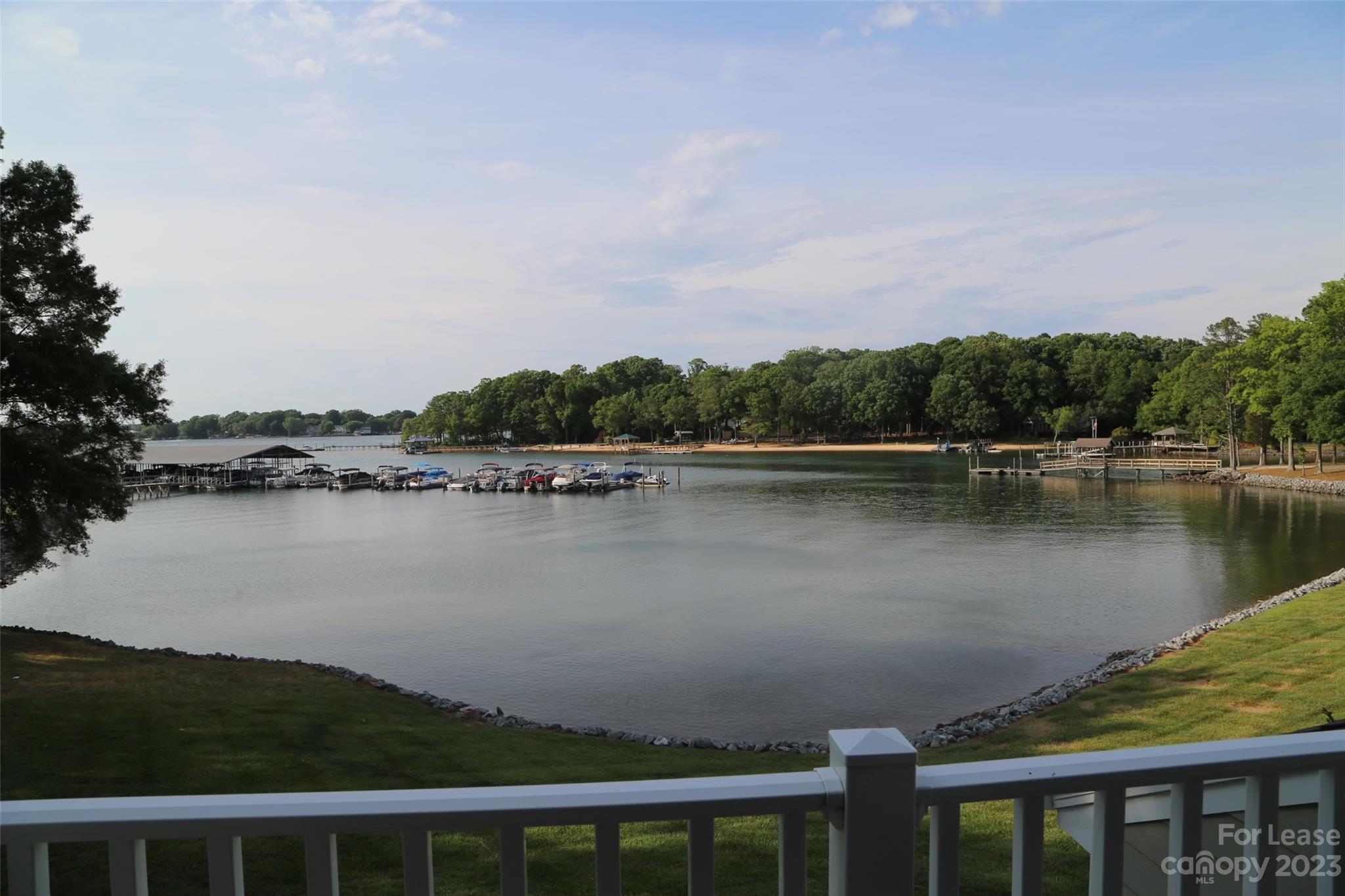Min 6 moth lease: Exclusive Offer: Free boat slip until March 1, 2024.  This one-of-a-kind, two-story waterfront home with expansive deep-water panoramic lake views offers a perfect combination of tranquil lake lifestyle and easy access to vibrant Big city life. It is the closest Lake Norman waterfront area to Charlotte and within walking distance to Birkdale Village for shopping, wine tasting, and fine dining. Easy access to I-77, I-85, and I-485. Community amenities include a tennis court, clubhouse, beach, pool, boat dock, and slips. This end unit features 3 large bedrooms, 3 bathrooms + bonus room. The kit has granite tops, tile backsplash, matching stainless appliances and tile flooring. The living area and master bedroom have gorgeous lake views.  Formal dining room, great room with a stone fireplace and bedroom with a full bath on the ground level. The premises was renovated and upgraded in 2022 to include new bathroom features, new LVP flooring. This is a non-smoking property.
