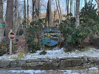 Lot 2.91 acre lot  privately located in desirable Sweet Water Farm, a small wooded subdivision located in Maggie Valley and 10 minutes from downtown Waynesville amenities.  Close to the Blue Ridge Parkway, 40 Minutes to Asheville or Cherokee Casino. Under ground utilities and community well (see attachment).  Tree clearing will open the view, high speed internet available. Private end lot.