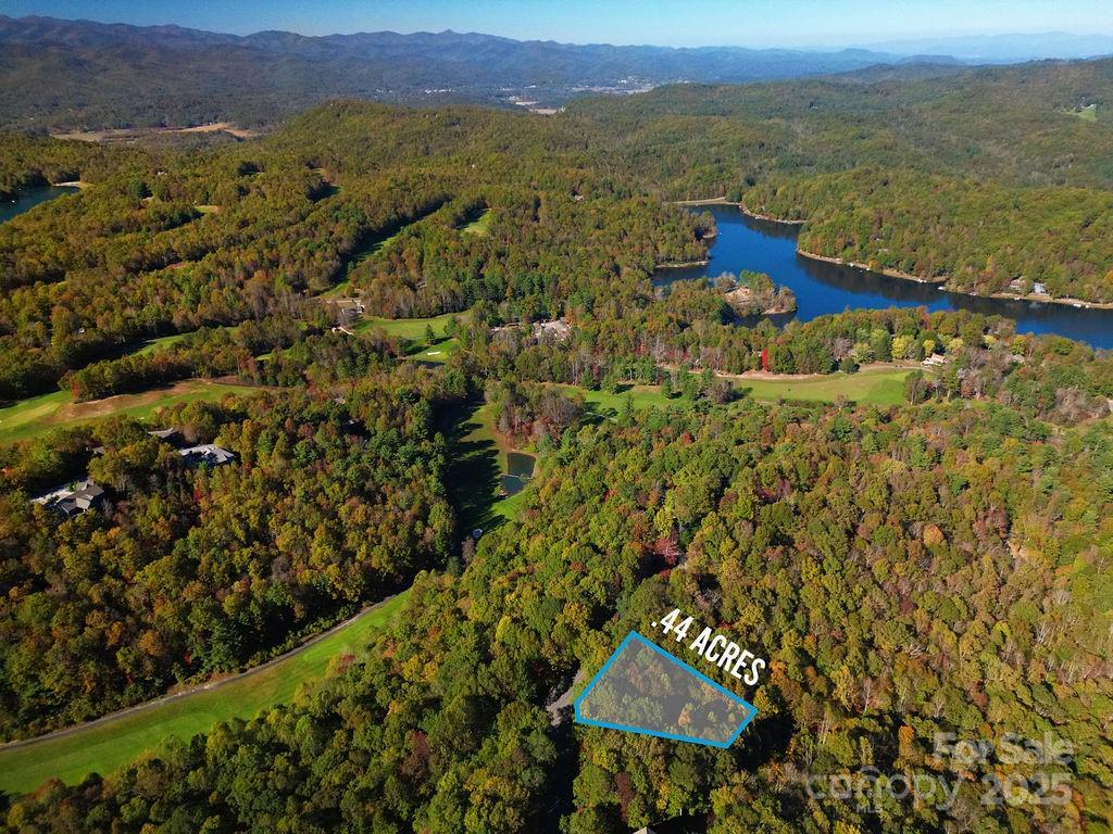 Fantastic homesite located in wonderful, gated Connestee Falls. Located less than 1/2 mile from the Connestee Clubhouse, golf course, pool, pickleball and tennis courts, and the new 12,000 SF Wellness Center, this lot is close to Lake Atagahi and only 1 mile from the East Fork Gate and Connestee Fire and Rescue.  The lot has access to both community water and sewer, offers mountain views, and lends itself to a zero-step entry home and level driveway. The neighborhood also offers approximately 25 miles of hiking trails, 4 lakes, waterfalls, bocce court, dog park, and more.
Convenient to downtown Brevard, Pisgah National Forest, Dupont State Forest, and endless adventure opportunities.