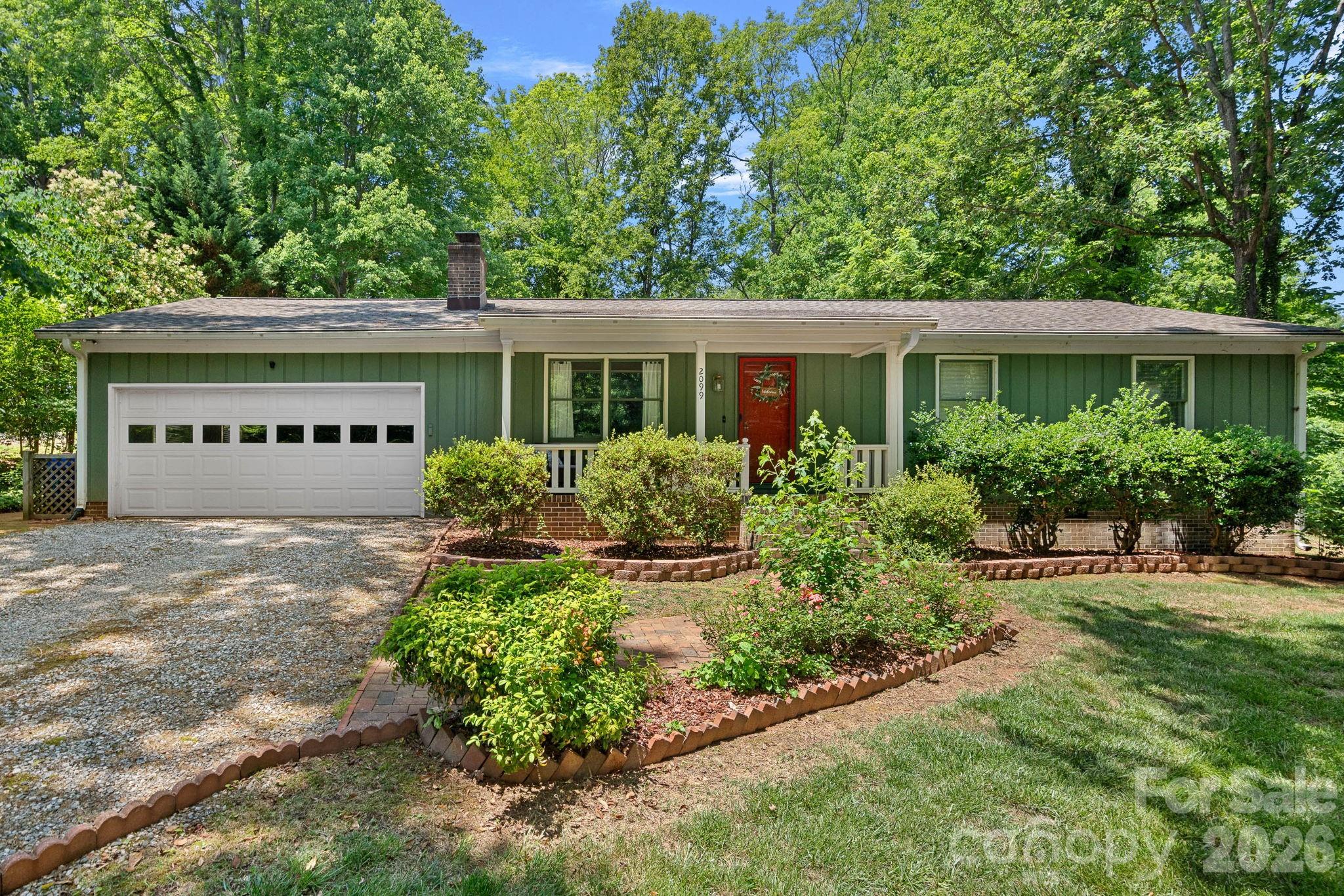 Tucked away on a peaceful cul-de-sac with no HOA, this beautifully maintained 3-bedroom, 2-bath ranch offers an exceptional combination of privacy, charm, and effortless indoor-outdoor living. Surrounded by a fully wooded backdrop, the property creates a serene retreat-like setting while remaining conveniently located to everyday amenities.

Designed for both relaxation and entertaining, the backyard features two elegant paver patios overlooking the private, partially fenced yard. A versatile detached outbuilding provides endless possibilities as a sophisticated home office, art or yoga studio, private retreat, workshop, or additional storage space.

Inside, timeless character and thoughtful updates shine throughout. The inviting family room centers around a cozy wood-burning fireplace, while the stunning sunroom serves as the heart of the home with soaring vaulted ceilings, abundant natural light, and custom privacy blinds installed in 2024. This bright and airy space offers the perfect setting for morning coffee, quiet evenings, or year-round enjoyment of the surrounding natural landscape.

The well-appointed kitchen is complemented by recent appliance upgrades, including a refrigerator (2025), dishwasher (2024), and microwave (2024). The conveniently located laundry area sits just off the kitchen, and the washer, dryer, and refrigerator all convey, offering added value and convenience.

Additional enhancements include new toilets installed in 2026 and professionally designed and maintained front landscaping that creates a warm and impressive first impression. Rich in character, thoughtfully updated, and nestled in a picturesque setting, this distinctive residence delivers the comfort, privacy, and lifestyle today's buyers are seeking.