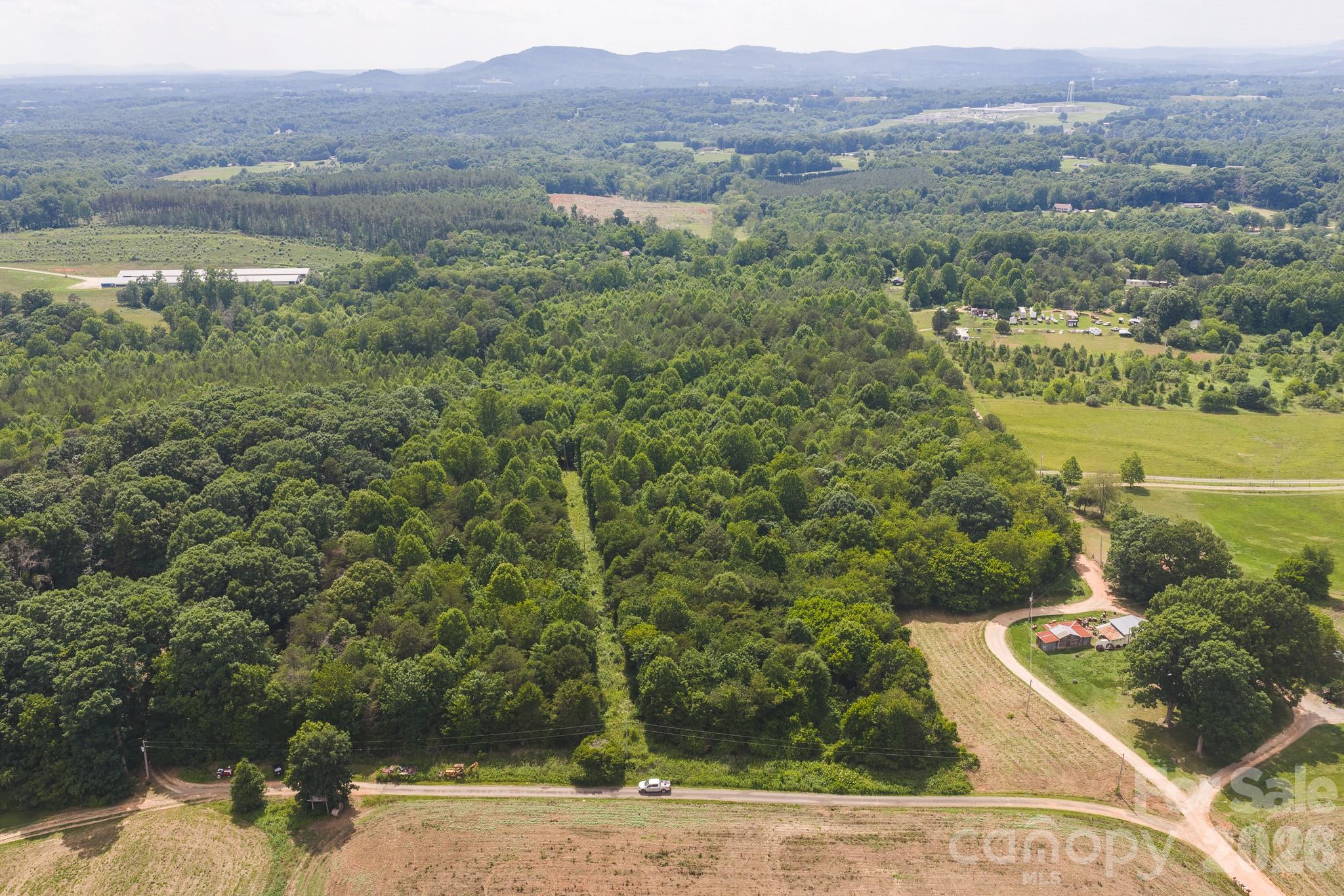 Unrestricted 8-acre wooded tract in the Millersville community of Taylorsville, NC. Located off Paul Payne Store Road along the shared gravel roadway known as Jeff Price Lane, this property offers a combination of privacy,  beauty, and convenience. Situated near the intersection of the Hiddenite and Wittenburg school districts, the tract is surrounded by mature hardwoods and provides a secluded setting for a variety of uses. Several Farms are located in the surrounding area.  Zoned r2r for a variety of uses.

Whether you're looking for a homesite, recreational property, weekend getaway, or long-term investment, this acreage offers plenty of possibilities. The terrain is relatively level and usable, making it well-suited for building, outdoor activities, or simply enjoying the wooded surroundings.

With no known restrictions, you'll have the flexibility to create the property that fits your needs. A 50-foot utility right-of-way is located along the edge of the property. Enjoy the opportunity to own a private tract of land in a convenient Alexander County location while still being just a short drive from Taylorsville, Hiddenite, and surrounding communities.

.