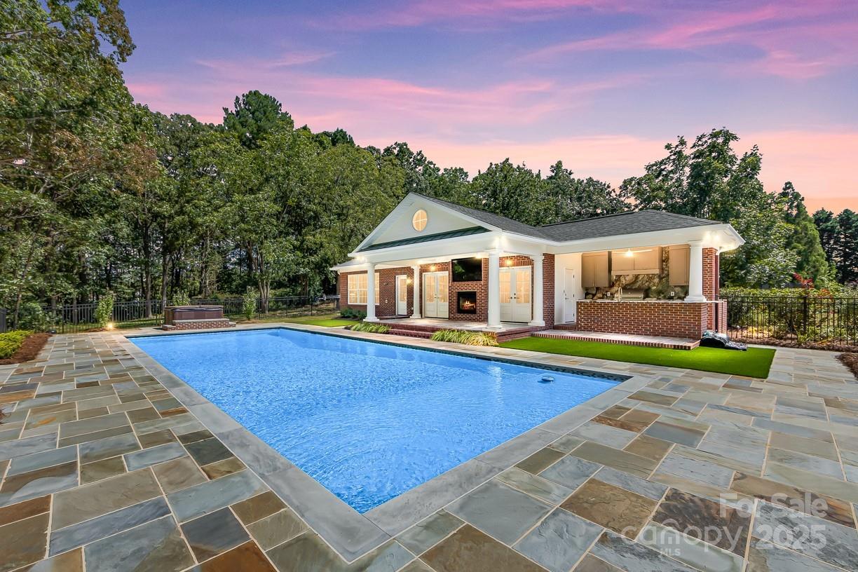 You will fall in love with this spectacular one story with Bonus/Bedroom 4 that makes a perfect Guest Suite or Private Office upstairs. The icing on the cake is the Custom, Full Brick Pool House with an additional 530 sf of Heated Living Area and Full Bath with High End Finishes, Huge Outdoor Grilling Veranda area with a Full Kitchen equipped with Ice Maker, Dishwasher and Refrigerators.  Covered Patio with Double Fireplace and a  225sf Garage/Man Cave/Gameroom all overlooking a 20ft x 40ft Gunite Saltwater Pool and Hot Tub.  Built in 2023,  with every bell and whistle you can think of including an Outdoor Shower.   Perfect Fort Mill, SC location in sought after Eppington South neighborhood with Custom Built Homes on large private lots.   This home has one of the largest lots in the neighborhood with 1.5 acres surrounded by mature trees, beautiful landscaping and full irrigation system. Very large covered back porch and large deck with seating overlooking a Koi Pond with waterfall.   Inside you will find gorgeous solid hardwood floors throughout the Main floor that are newly refinished.  Newer Windows, Gutters, and Garage Doors.   All new plumbing fixtures, new toilets, new lighting, new carpet upstairs, new vanities in 2 of the full baths, new interior paint, new paint on  back deck and much more.  There is plenty of parking with a large circular drive and long primary driveway leading to an oversized 2 car garage.  The Family Room and Primary Bedroom have soaring, vaulted ceilings and an abundance of windows that provides great natural lighting.  You will not want to miss seeing all of the great entertainment spaces in this move in ready home. Nationally Ranked Fort Mill Schools and minutes to I-77,  exit 88 Gold Hill Road.