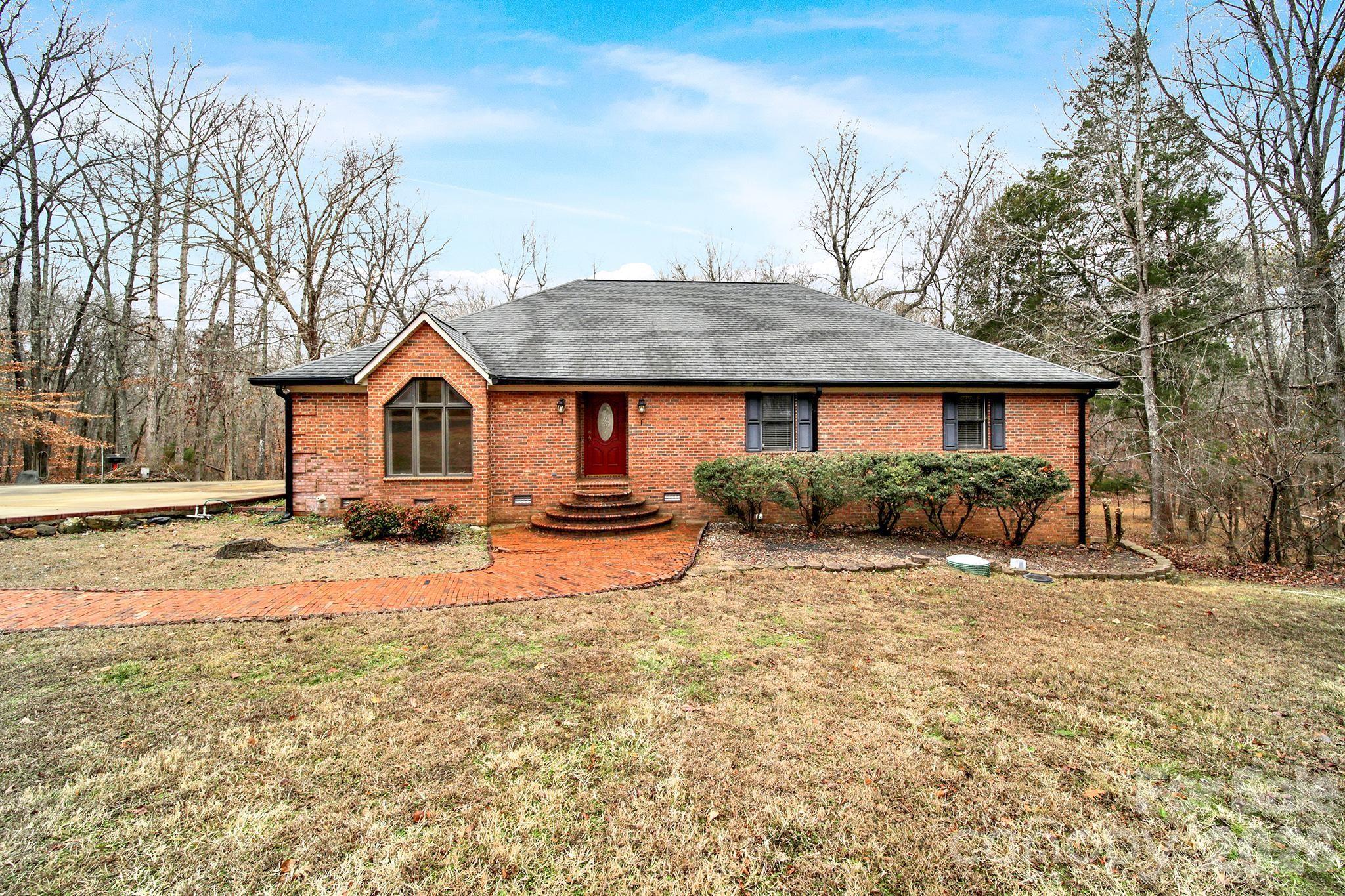 One's loss is another's gain... This is back on the market due to the previous buyer's financing falling through. If you’ve been waiting for space, privacy, and a setting that feels like a peaceful getaway, this well-maintained brick ranch on 2.4 acres delivers it all. Tucked away on a cul-de-sac with no HOA and no city taxes in a prime location of Catawba, SC, this brick home offers a solid and spacious layout with 4 bedrooms, 2 full bathrooms, 2 large living spaces, laundry room with sink and an eat-in kitchen. Step out onto the large trex deck from both the living room and the primary bedroom as you take in the view and serene water sounds of the gorgeous creek running along the back of the property. Notice the amount of storage you have inside, as well as outside, under the deck and in the impressive walk-in crawlspace with a garage door for easy equipment storage. Walk across the driveway to a hobbyist’s dream of a detached, three-bay heated and cooled garage plus workshop that easily fits several vehicles. The garage has it's own HVAC, water heater and a half bathroom. It also has several rooms to utilize for storage and/or offices, and a large carport right outside for extra vehicles or projects. Great location to retreat to after a long day while still close to the city and interstate for easy commutes to Charlotte and Columbia.
