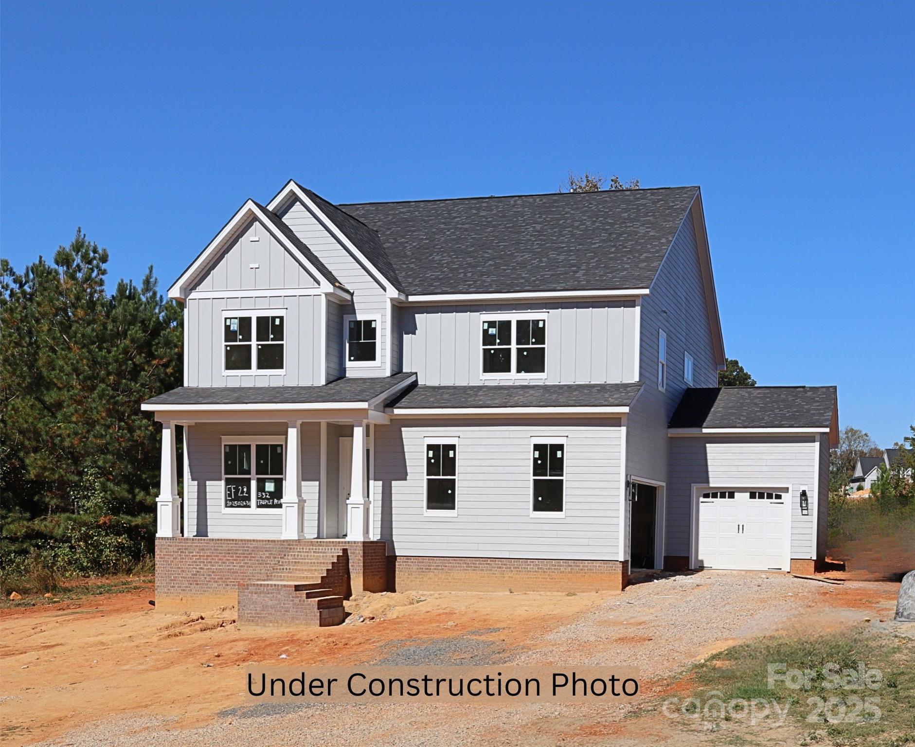 Construction near completion! Discover serene living just 20 minutes from Lake Wylie with this stunning NEW CONSTRUCTION home on a spacious 1-acre homesite in the new Edmunds Farm neighborhood. The St Andrews floor plan offers an expansive primary suite on the main level and soaring 10' ceilings that enhance the open-concept design. The chef’s kitchen features floor-to-ceiling cabinetry, quartz countertops, and a farmhouse sink, seamlessly flowing into the dining area and coffered-ceiling family room that opens to a covered back porch. Additional highlights include: Versatile study for formal dining or office use; Hardwood flooring throughout the main level; Luxurious owner’s suite with tray ceiling, dual quartz vanities, walk-in tiled shower, and oversized closet; Spacious upstairs loft ideal for gaming, fitness, and area for workstation; Extended covered deck for outdoor entertaining; 3-car garage with ample storage for tools and toys! Enjoy the perfect blend of peaceful surroundings and refined finishes—your escape from the everyday starts here. Photos/video representative & some details may differ. Items in MLS may change during construction & may differ from finished property. Verify pricing/options with builder representative.  Estimated completion in January. Other plans and homesites available!