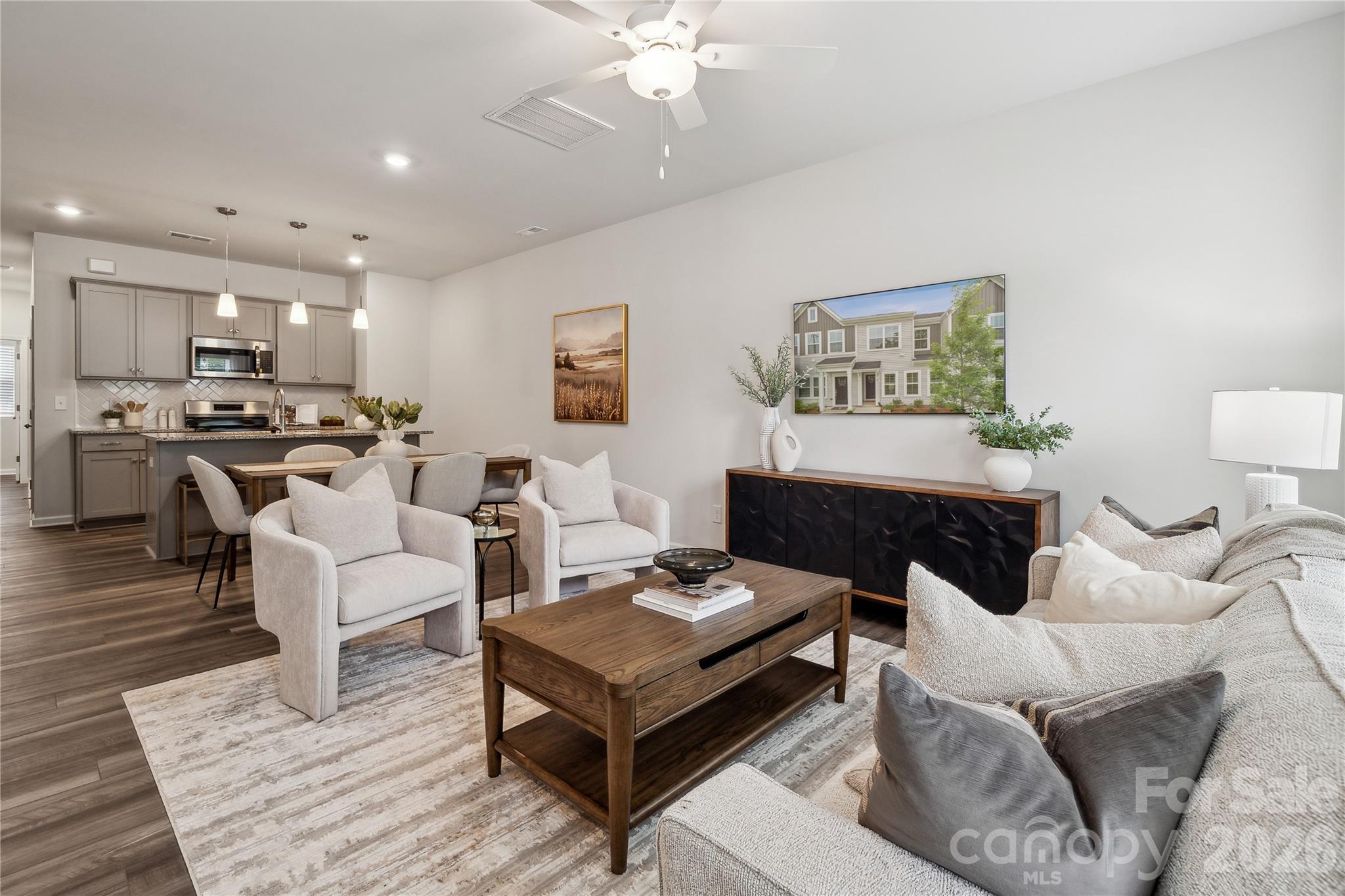 Welcome to this thoughtfully designed two-story townhome offering three bedrooms and two-and-a-half baths. Just inside the front entry, you’re greeted by a spacious open-concept family room that flows seamlessly into the kitchen and inviting eat-in dining area—perfect for both everyday living and entertaining.

Upstairs, the primary suite provides a comfortable retreat, complete with a boxed ceiling, a generous walk-in closet, and an en-suite bath featuring dual vanities. Two additional bedrooms and a full bathroom offer flexibility for guests, family, or a home office. A conveniently located laundry closet just outside the secondary bedrooms adds ease to daily routines.

Additional highlights include a one-car garage with direct entry, where you’ll find a powder room and a practical drop zone with built-in bench seating and cubbies—ideal for keeping everything organized and within reach.