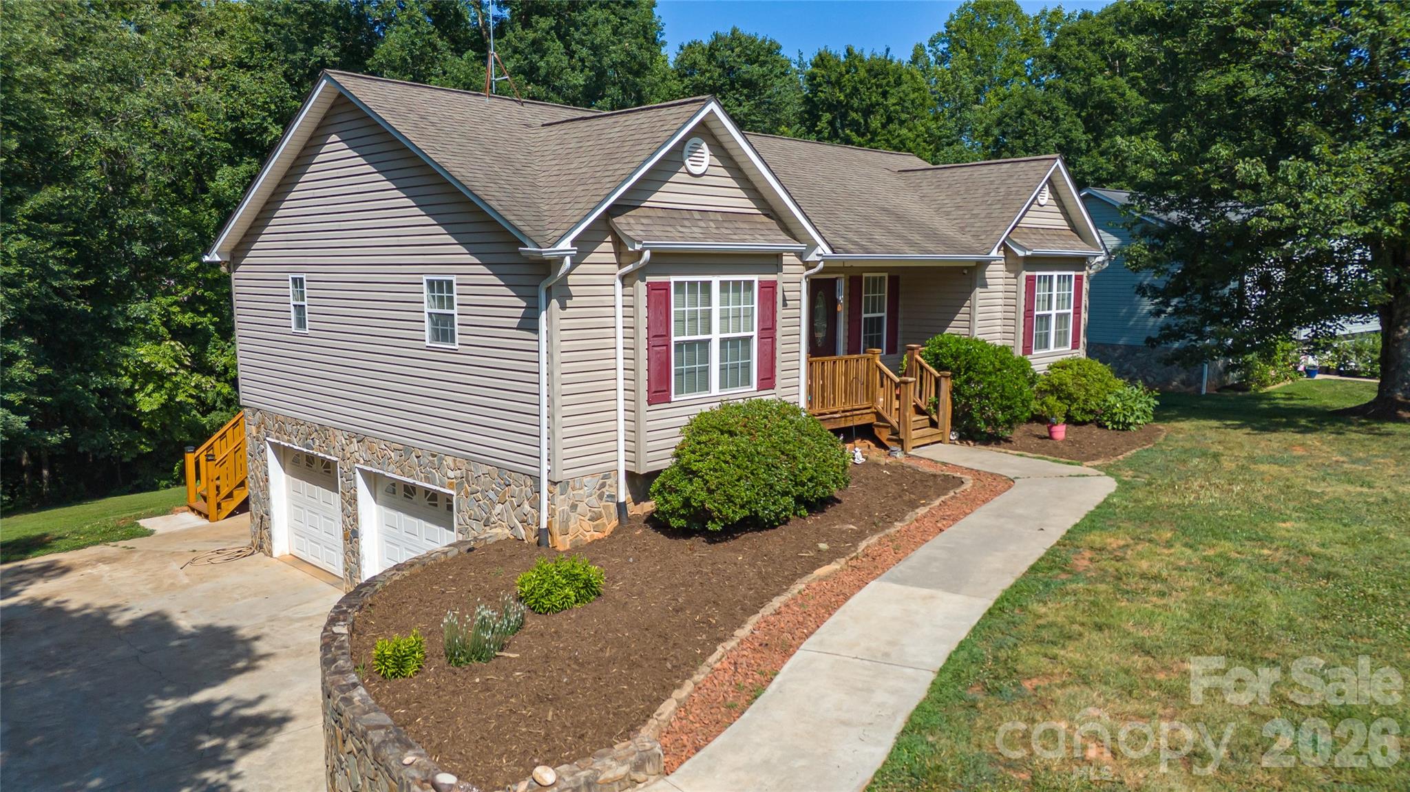 Must see this 3BR 2Ba ranch w/split bedroom layout and ready to move right in. Home features large .8 acre lot with lots of room to play. Many updates including vinyl plank flooring, galley kitchen w/granite countertops and stainless steel range, refrig, dishwasher and microwave. Oversized main floor primary bedroom w/walk in closet and large owner bath w/dbl vanity and walk in shower. Other bedrooms are ample size plus 2nd full bath for guest. Home also includes full basement partially finished w/huge family or game room plus oversized 2 car garage. Great location convenient to Hickory, Lenoir or Morganton and no city taxes. Home also includes 1 year home buyer warranty.