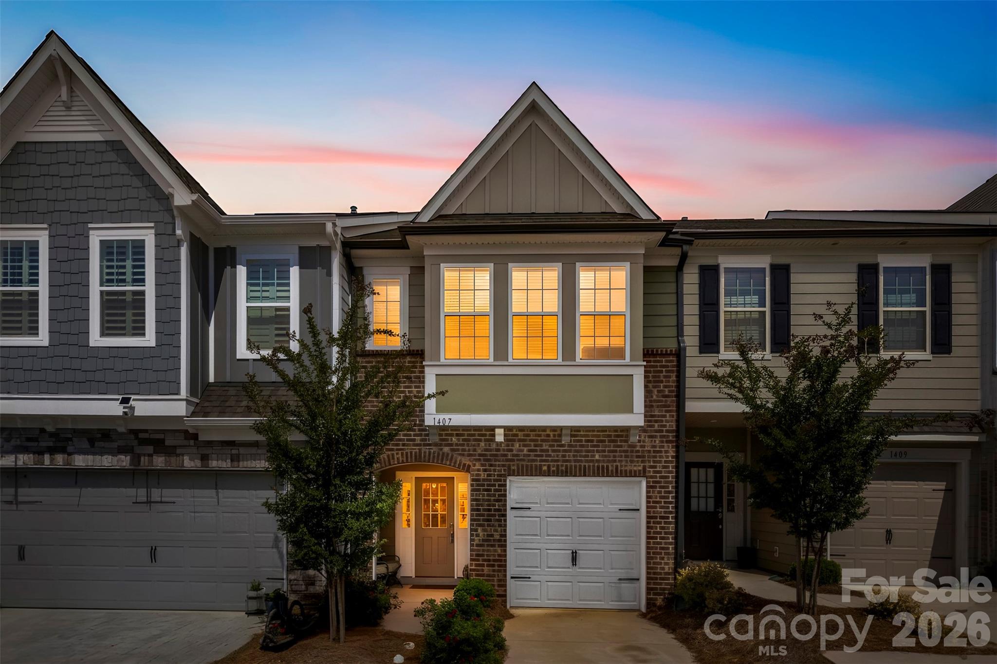 **Eligible for 0% Down, No PMI & 5K Lender Credit** Lake life without the Lake Wylie price tag! This upgraded townhome in sought-after Paddler's Cove offers resort-style amenities: community pool, open-air pavilion, walking trails, and direct access to Field Day Park (a 32-acre athletic complex with soccer fields and sports courts). Launch a paddle board from the neighborhood's private Crowders Creek access, which flows right into Lake Wylie. Walk to the Clover Aquatic Center, YMCA, shopping, and the iconic Camp Thunderbird. Inside: granite kitchen with tile backsplash, stainless appliances, upgraded gas range, and a large island with breakfast bar. Wood-tread stairs with craftsman balusters (upgrade). Spacious living and dining area. Split-bedroom plan upstairs with a private Primary suite at the rear — tray ceiling, sitting area, walk-in closet, double vanity, and an upgraded tile shower. Secondary bath has double sinks and tub/shower combo. Top-rated Clover schools, low SC taxes of approximately $1,750 per year (Zillow shows inaccurate tax amount), and an easy Charlotte commute. Don't miss this one!