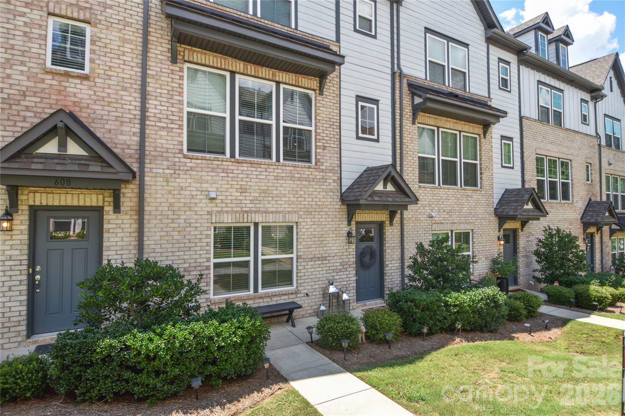 Welcome to 612 Tudor Park Way, a bright and modern three-story townhome in the desirable Wendwood Terrace community in always charming Cotswold with close commute times to all of Charlotte, Uptown, and more! This 4-bedroom, 3.5-bath townhome features an open-concept layout, abundant natural light, and no carpet to be found - offering a clean, contemporary feel throughout. The entry level includes a 2-car garage as well as a private guest bedroom with a full bath - ideal for guests or a home office. The main living level showcases a spacious gathering area, dining space, and a gourmet kitchen with upgraded white cabinetry, granite countertops, a gas cooktop, and convection microwave and oven. Step out onto the deck to enjoy morning coffee or fresh air. Upstairs, you’ll find two secondary bedrooms, a full hall bath, and a generously sized primary suite. 4-bedroom and 3-full bathroom units are hard to come by in this community! The neighborhood features a central pocket park, sidewalks, and a dog park, all just minutes from SouthPark, Elizabeth, Plaza Midwood, Uptown, and more. A must-see home offering comfort, style, and unbeatable access to all of Charlotte’s best amenities.