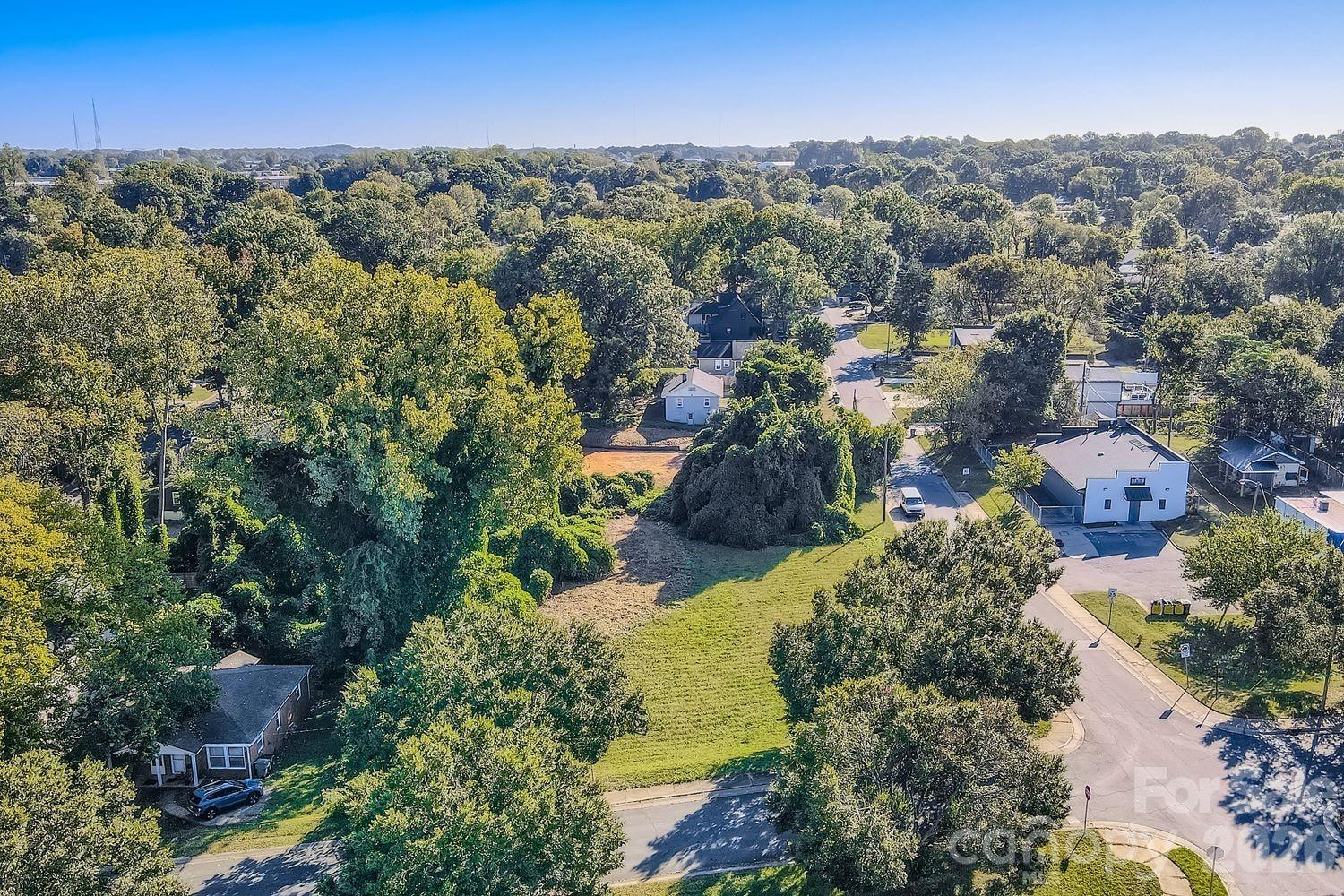 Exceptional opportunity to invest in a lot or build on a lot in a high growth area of Charlotte! The location of this lot has countless amenities. The lot is within minutes of Uptown Charlotte, has easy access to several major highways (I-77, I-277, and I-85), and access to public transportation. The community is experiencing exciting growth, with new construction throughout the area and new townhome development directly across the street! There are several shopping and restaurant options in nearby Camp North End. Outdoor enthusiasts will love having a community park and garden within a short distance, perfect for relaxation or recreation. Per City of Charlotte Water - New Service Department (980-338-1289), there is city water and city sewer available. Please call for tap fees. Lastly, there is an encroachment that appears to be within the 17' Front Setback, please see attached survey.