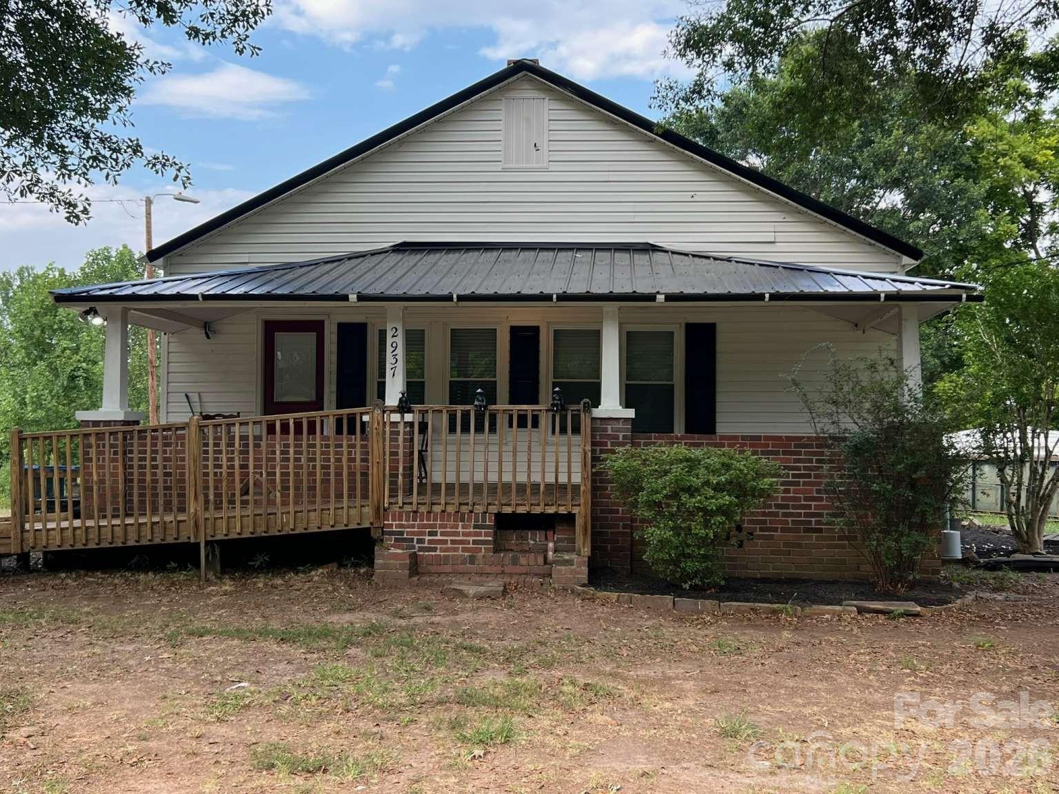 Welcome home to this extensively updated gem nestled in the quiet countryside of Lincoln County! This spacious 2-bedroom, 1-bathroom single-story home has been thoughtfully remodeled from the ground up and is ready for its next chapter — offering the perfect blend of modern updates, wide-open space, and the tranquil country lifestyle so many buyers are searching for. Completely Remodeled — Move-In Ready This home has undergone a thorough renovation, so you can move in with confidence and peace of mind. Major updates include all-new subfloors and beautiful new luxury vinyl tile (LVT) flooring throughout, giving the interior a clean, modern feel that's as durable as it is attractive. Brand new windows flood every room with natural light while improving energy efficiency and curb appeal. And topping it all off — literally — is a brand-new metal roof, built to last for decades and designed to handle whatever the Carolina weather brings. Space, Comfort & Versatility Whether you're raising a family, setting up a home office, hosting guests, or exploring multi-generational living arrangements, there's space here to make it all work. 1 Acre of Unlimited Potential Step outside and breathe in the fresh country air. The property sits on a full 1-acre lot along Gastonia Highway, surrounded by the peaceful quiet that only true country living can offer. No crowded neighborhoods, no city noise — just wide-open spaces and the freedom to make it your own. The land offers endless possibilities: build a workshop or garage, add a storage building or barn, plant a large garden, create an outdoor entertainment area, or even explore adding an additional structure. The choice is yours. Location Done Right Enjoy the best of both worlds — the serenity of country living with convenient access to all that Lincolnton has to offer. Downtown Lincolnton's shops, restaurants, and services are just a short drive away, and the Gastonia Highway corridor keeps you well-connected to neighboring communities as well. Property Highlights: • Single-Story Home | 1 Acre Lot • All-New Subfloors & Luxury Vinyl Tile (LVT) Flooring Throughout • Brand-New Windows • New Metal Roof • Quiet, Private Country Setting • Land Ready for Additional Structures or Improvements This is a truly special opportunity to own a fully updated home with room to grow in one of Lincoln County's most peaceful settings. Properties like this — move-in ready, spacious, and sitting on a full acre — don't come along often. Call or message the owner today to schedule your private showing!
