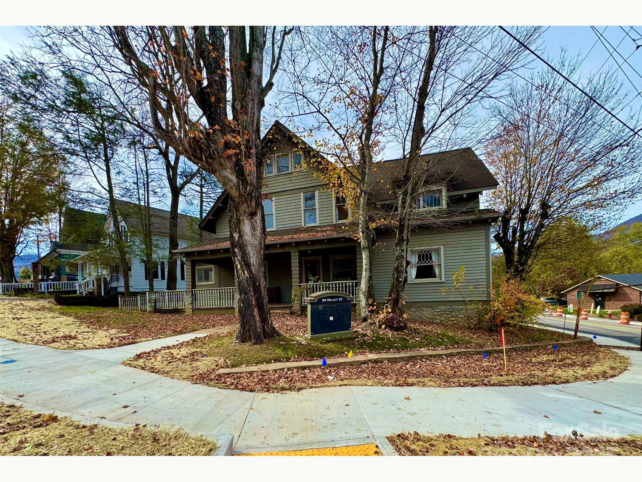 Rare opportunity to own a Historical Arts and Crafts Office building in the central business district with parking included! Located on a High visibility Corner Lot, this building retains its original historic charm including original hardwood floors and woodwork, while providing modern amenities of Central Heat and Air Conditioning, Pre-wired for High Speed Internet Connections through-out, Easy access, Onsite paved parking with ADA walkway/ramp to  front door, and Street parking. Walk to the courthouse, Main Street Waynesville, shops and restaurants. Suited to many possible commercial uses including retail, office, professional services, brewpub, art studio and more. Waynesville continues to show rapid economic and population growth bolstered by a unique mix of small town mountain charm.